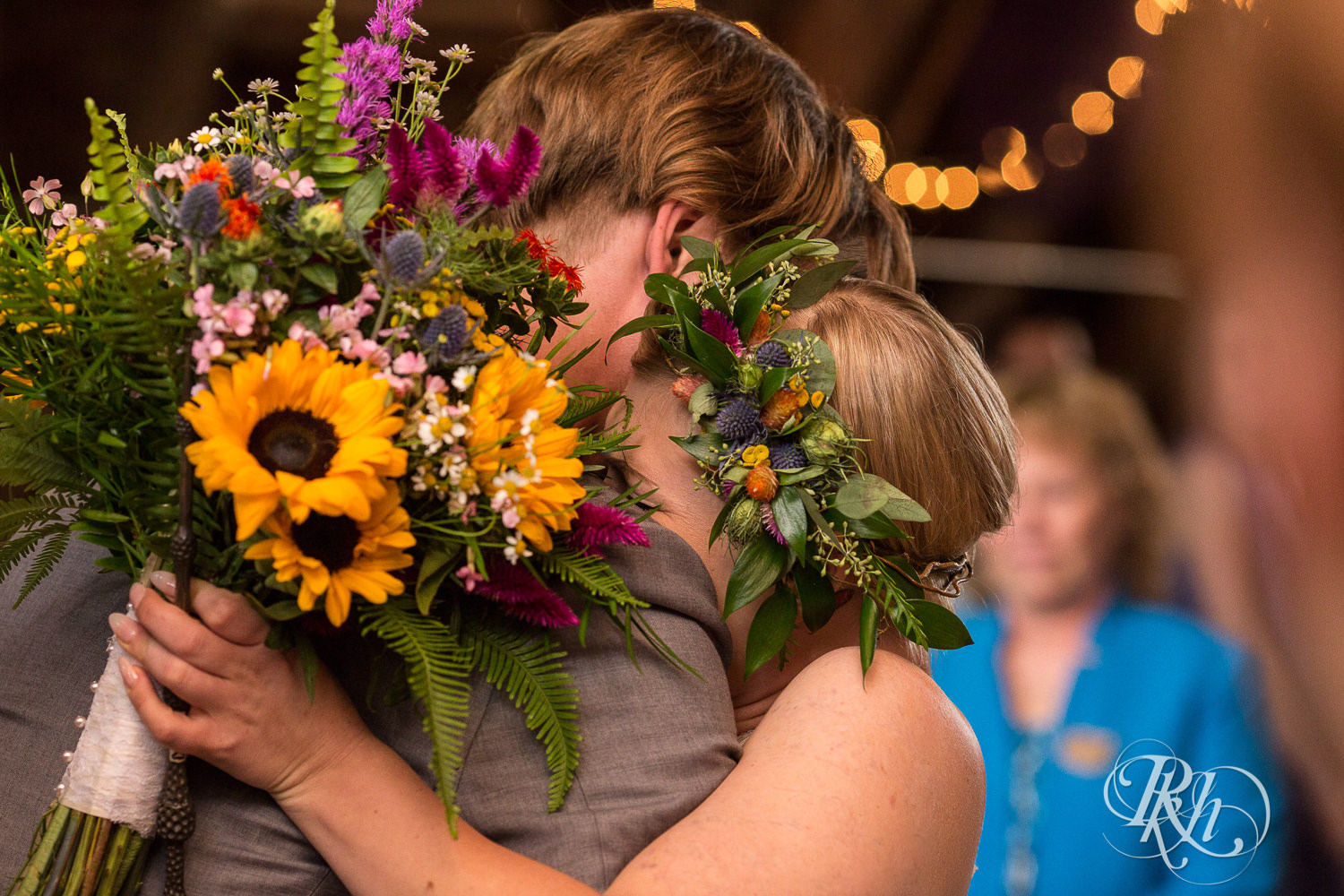 Bride and mom walk down the aisle at wedding ceremony at Coops Event Barn in Dodge Center, Minnesota.