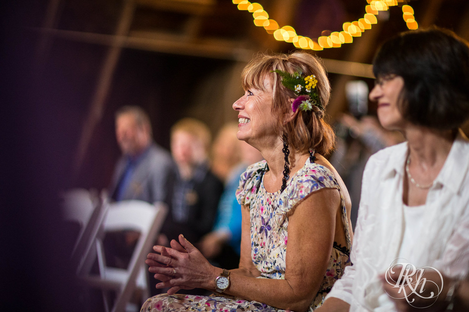 Mom smiles during wedding ceremony at Coops Event Barn in Dodge Center, Minnesota.