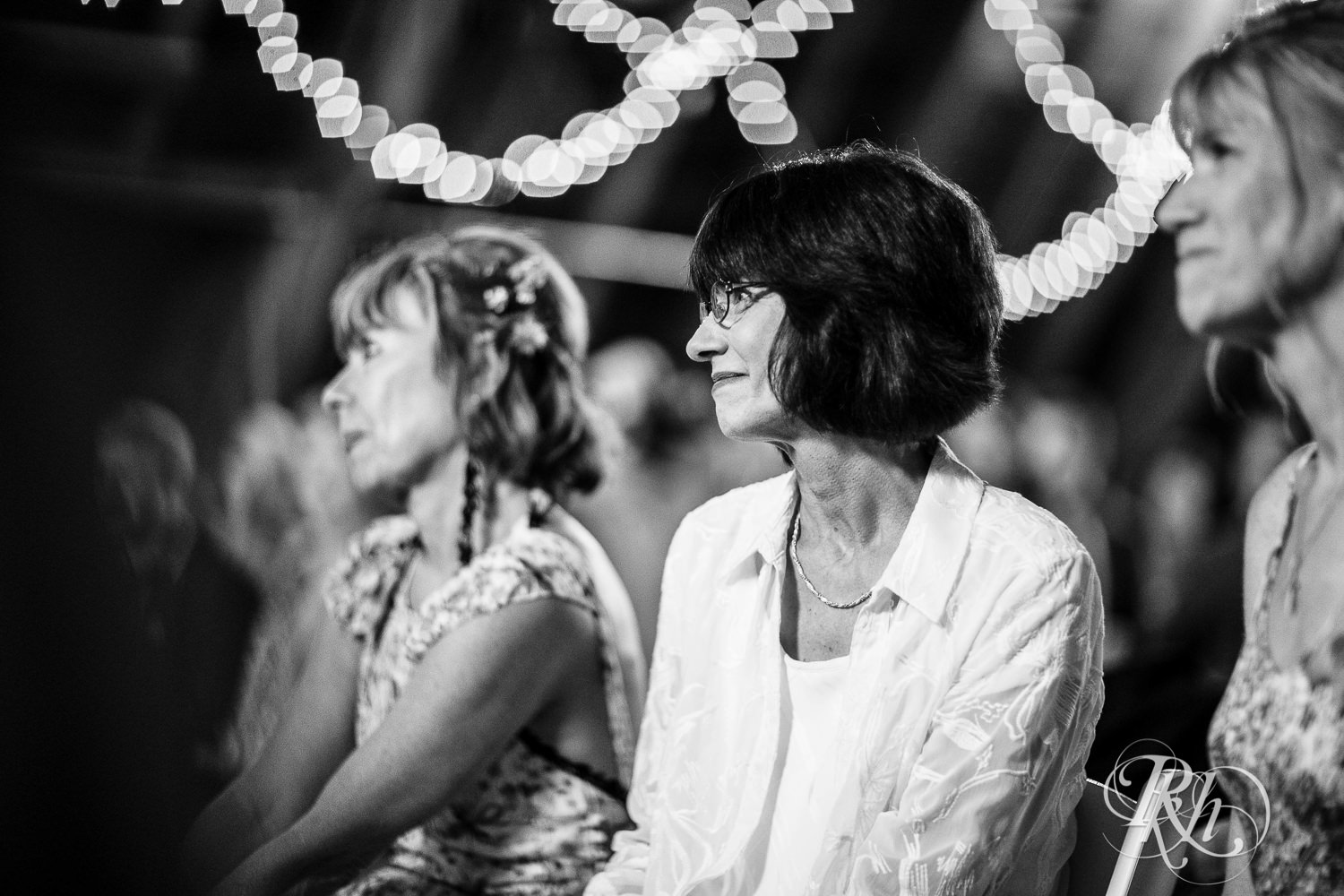 Mom smiles during wedding ceremony at Coops Event Barn in Dodge Center, Minnesota.