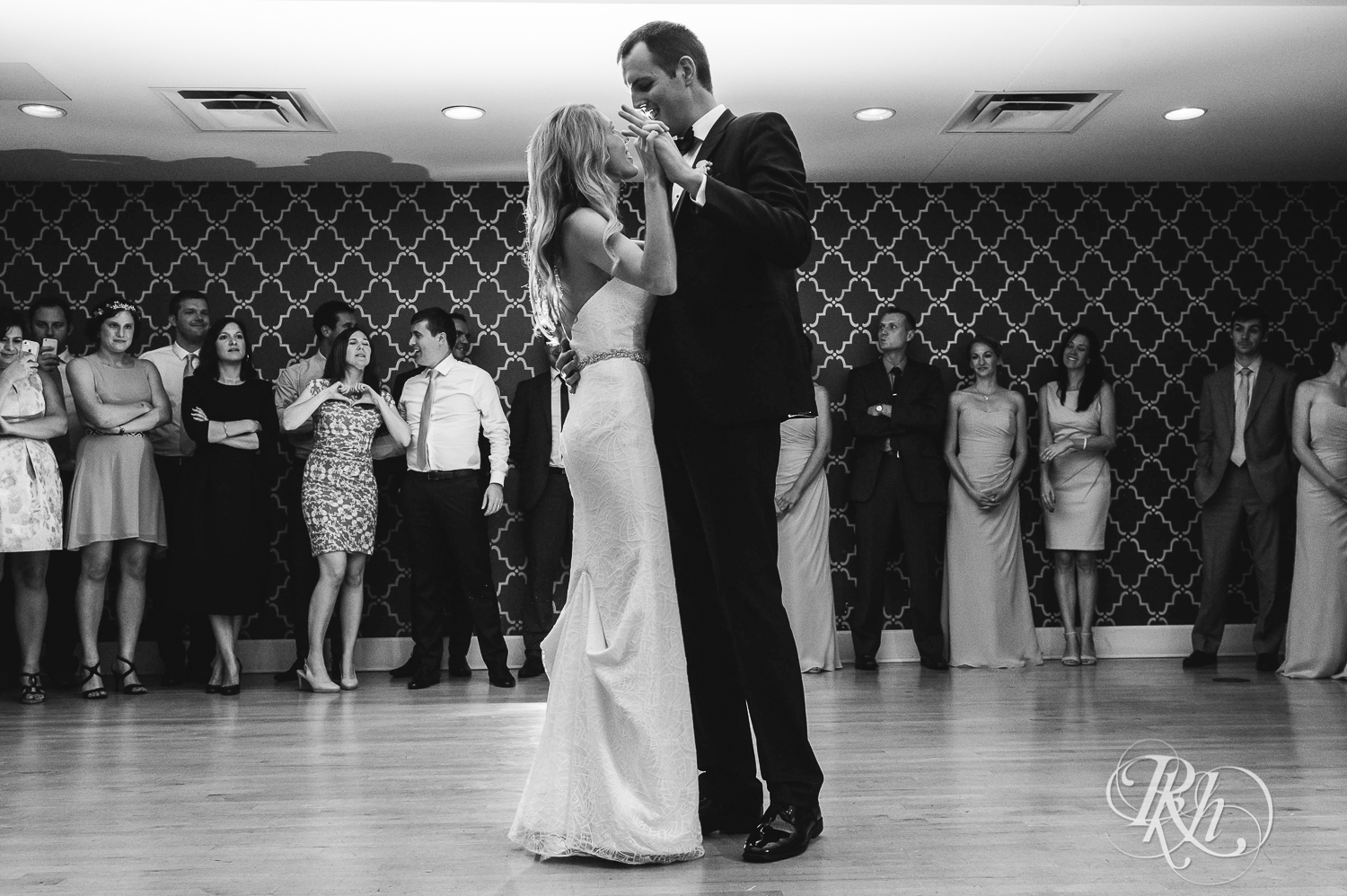 Bride and groom dance during reception at White Bear Yacht Club in Dellwood, Minnesota.