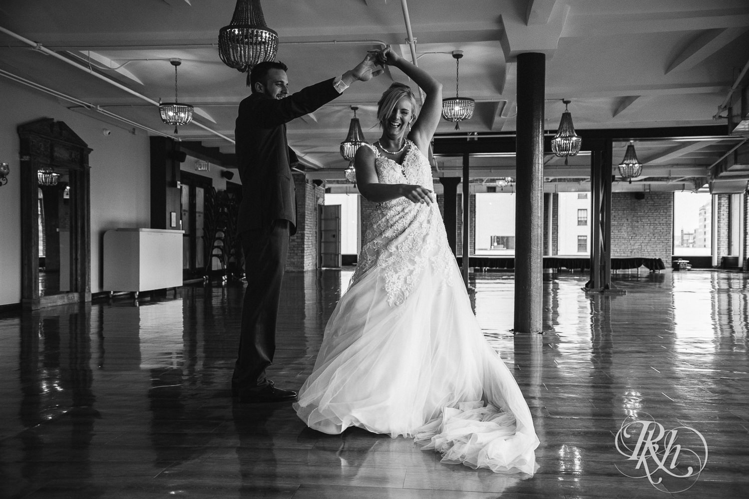 Bride and groom dance on wedding day at Lumber Exchange Event Center in Minneapolis, Minnesota.