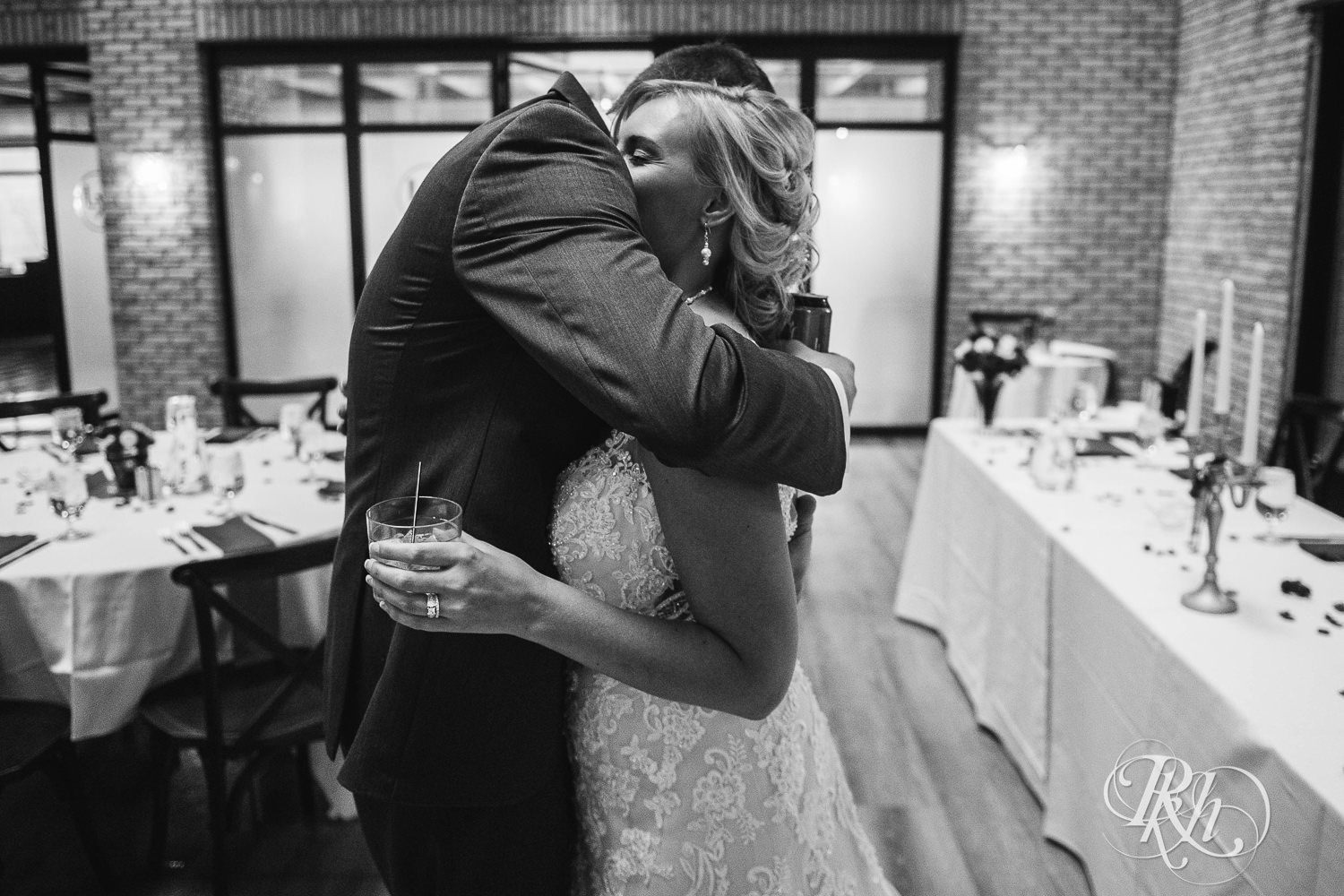 Bride and groom hug at the Lumber Exchange Event Center in Minneapolis, Minnesota.