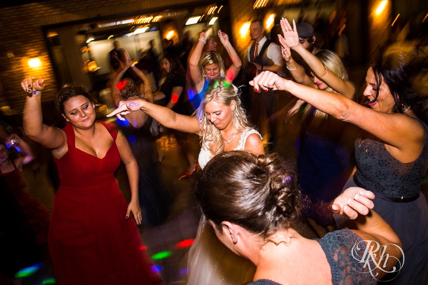 Guests dance at wedding reception at the Lumber Exchange Event Center in Minneapolis, Minnesota.
