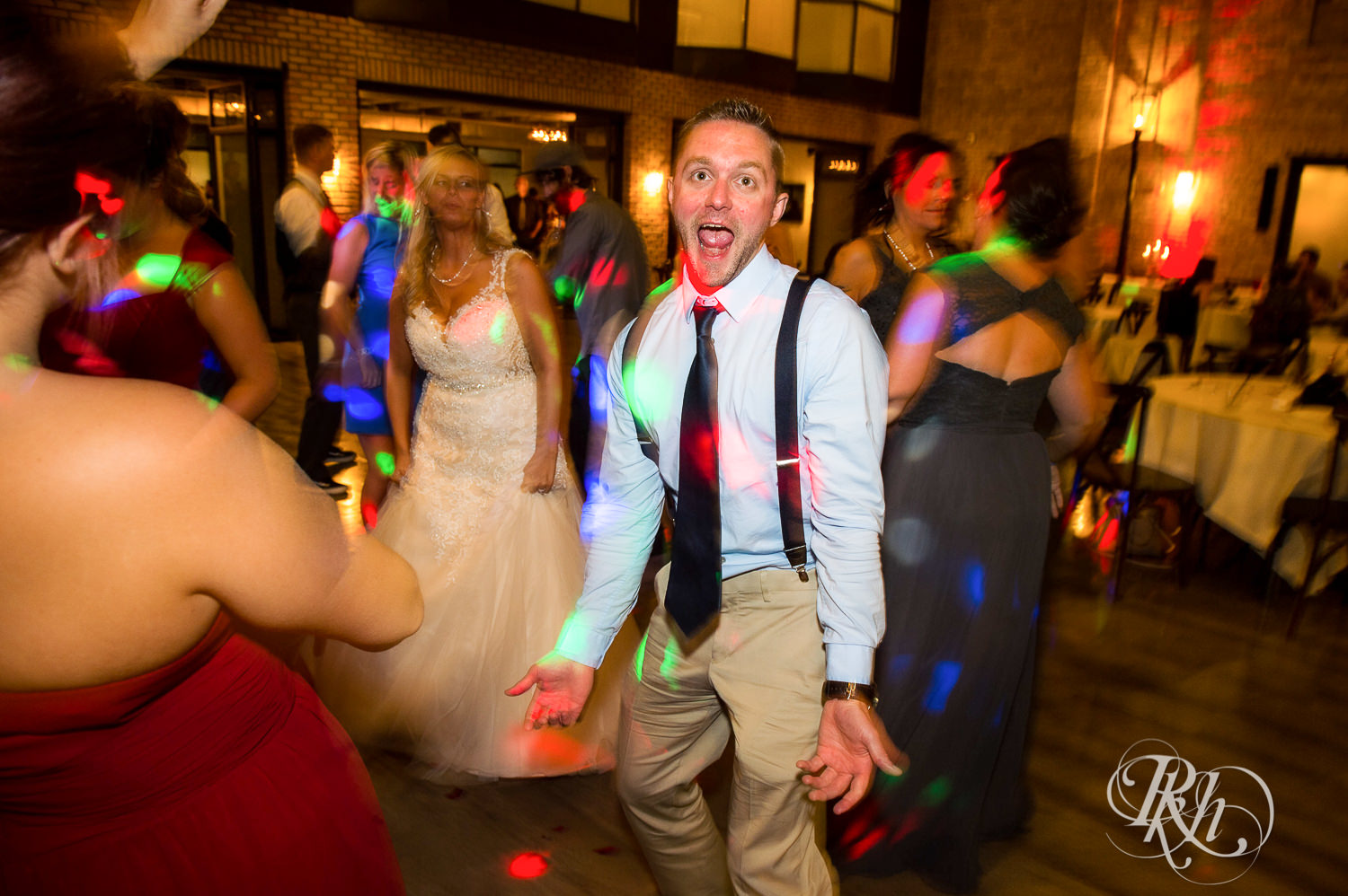 Guests dance at wedding reception at the Lumber Exchange Event Center in Minneapolis, Minnesota.