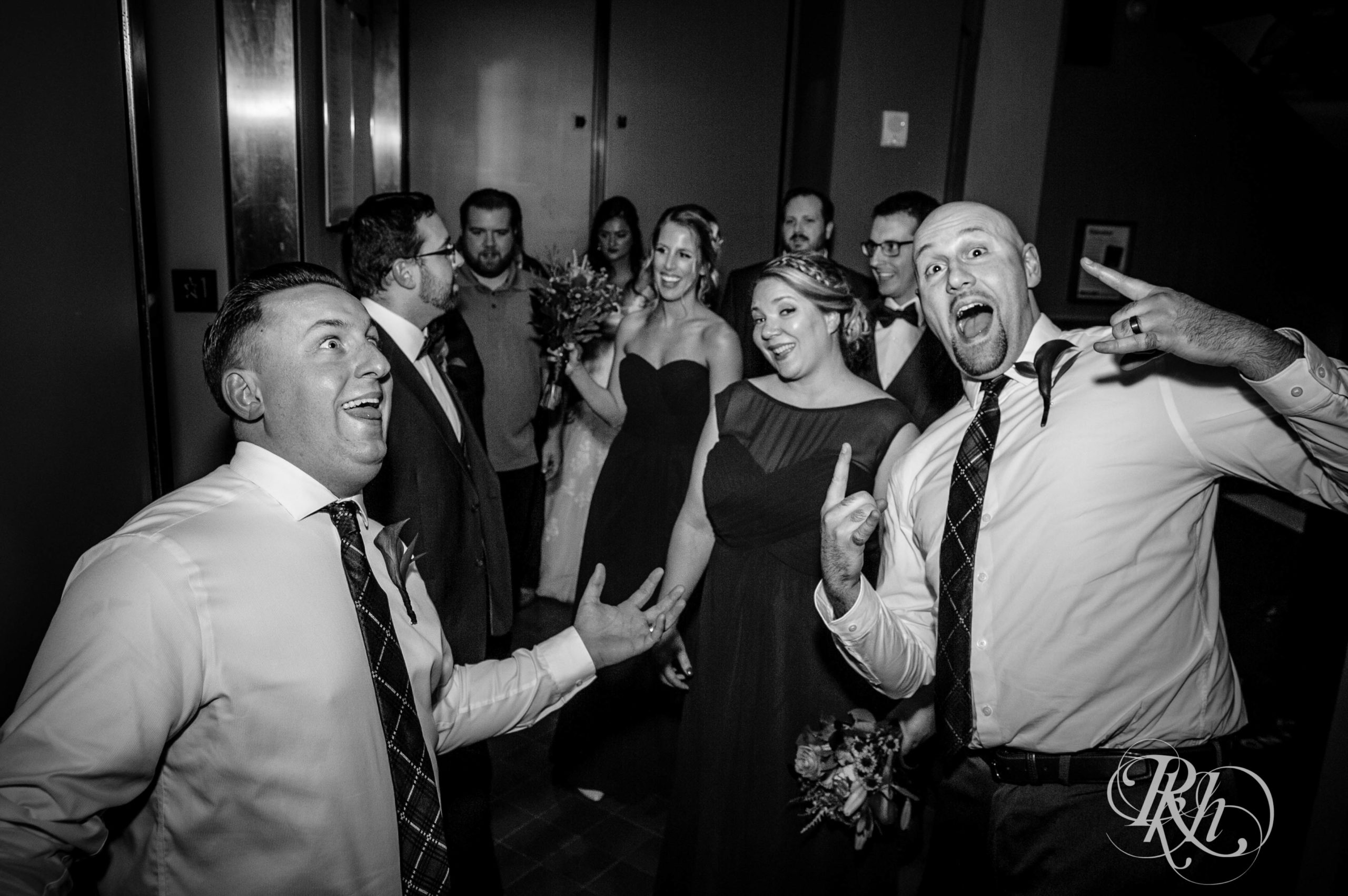 Guests smile on wedding day at Landmark Center in Saint Paul, Minnesota.