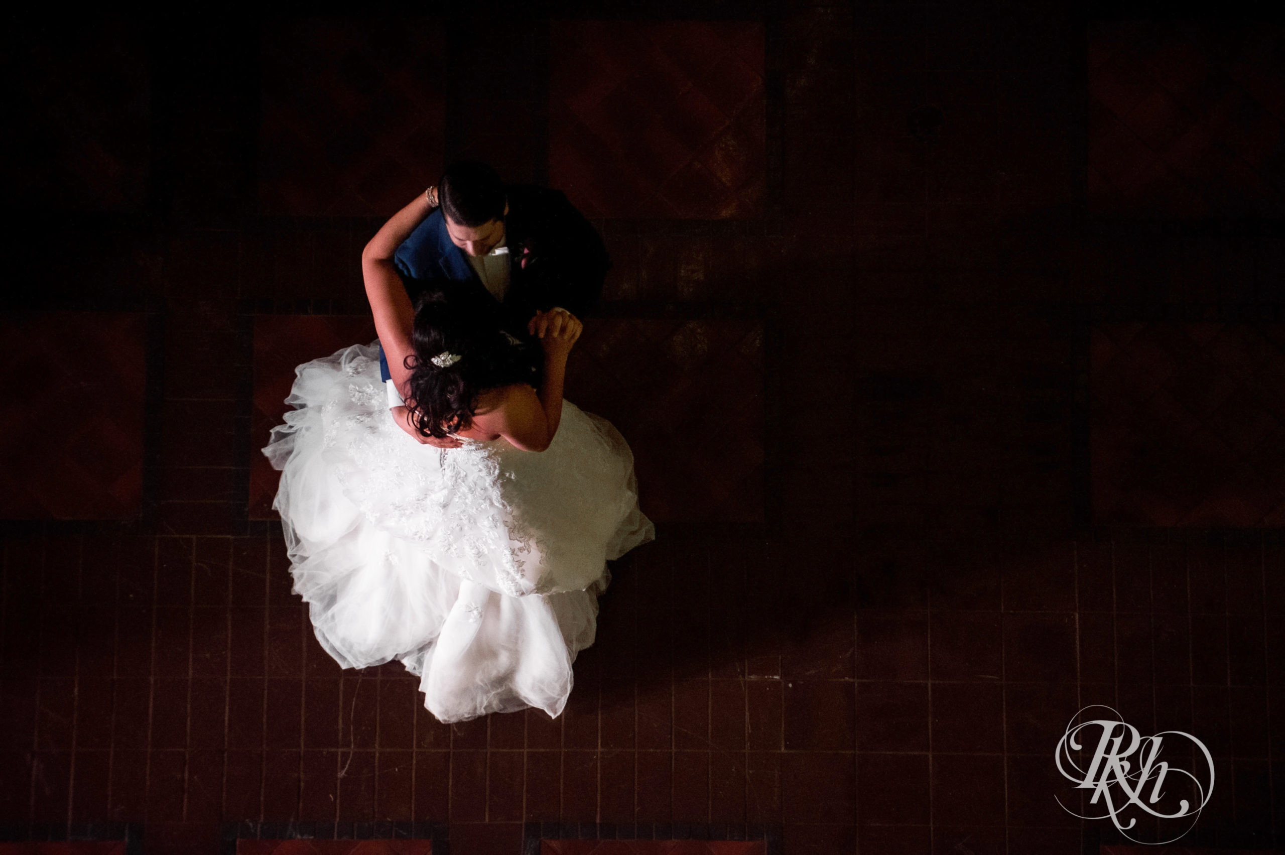 Bride and groom share first dance on wedding day at Landmark Center in Saint Paul, Minnesota.