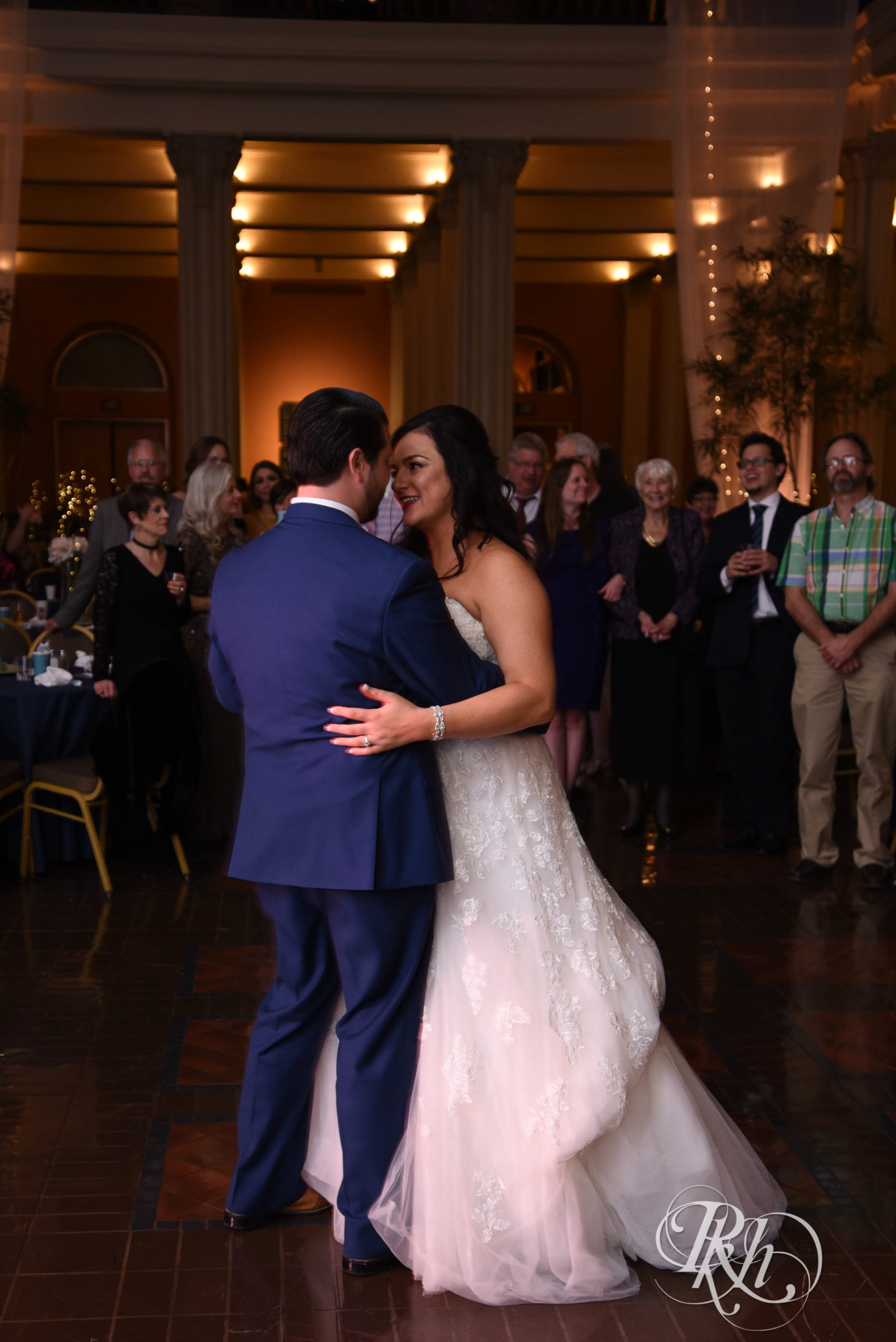 Bride and groom share first dance on wedding day at Landmark Center in Saint Paul, Minnesota.