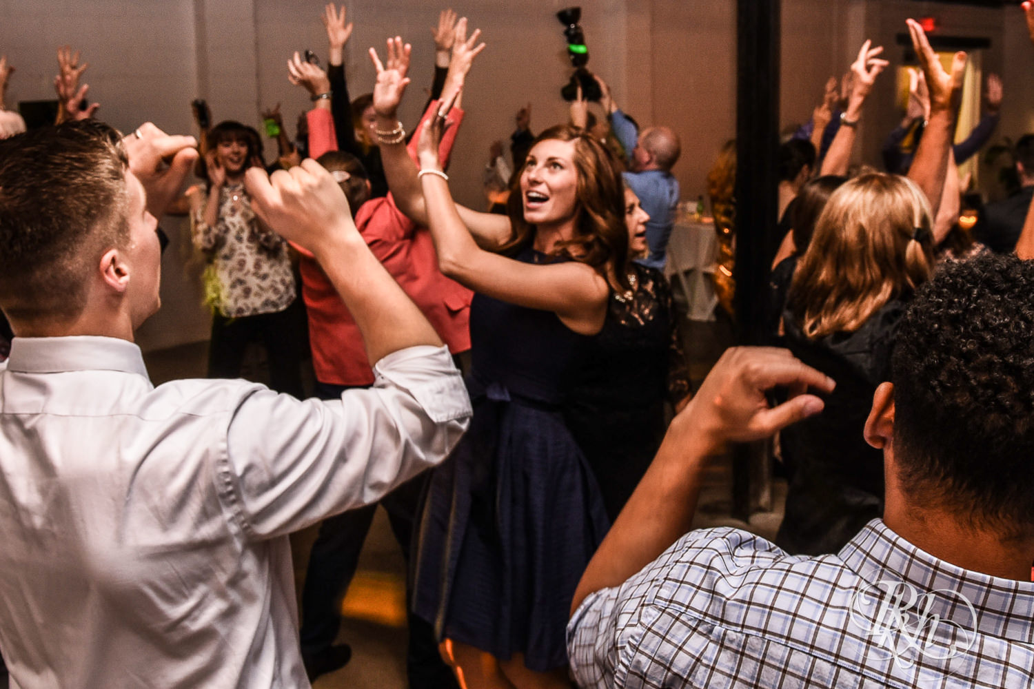 Guests dance during wedding reception speeches at Paikka in Saint Paul, Minnesota.