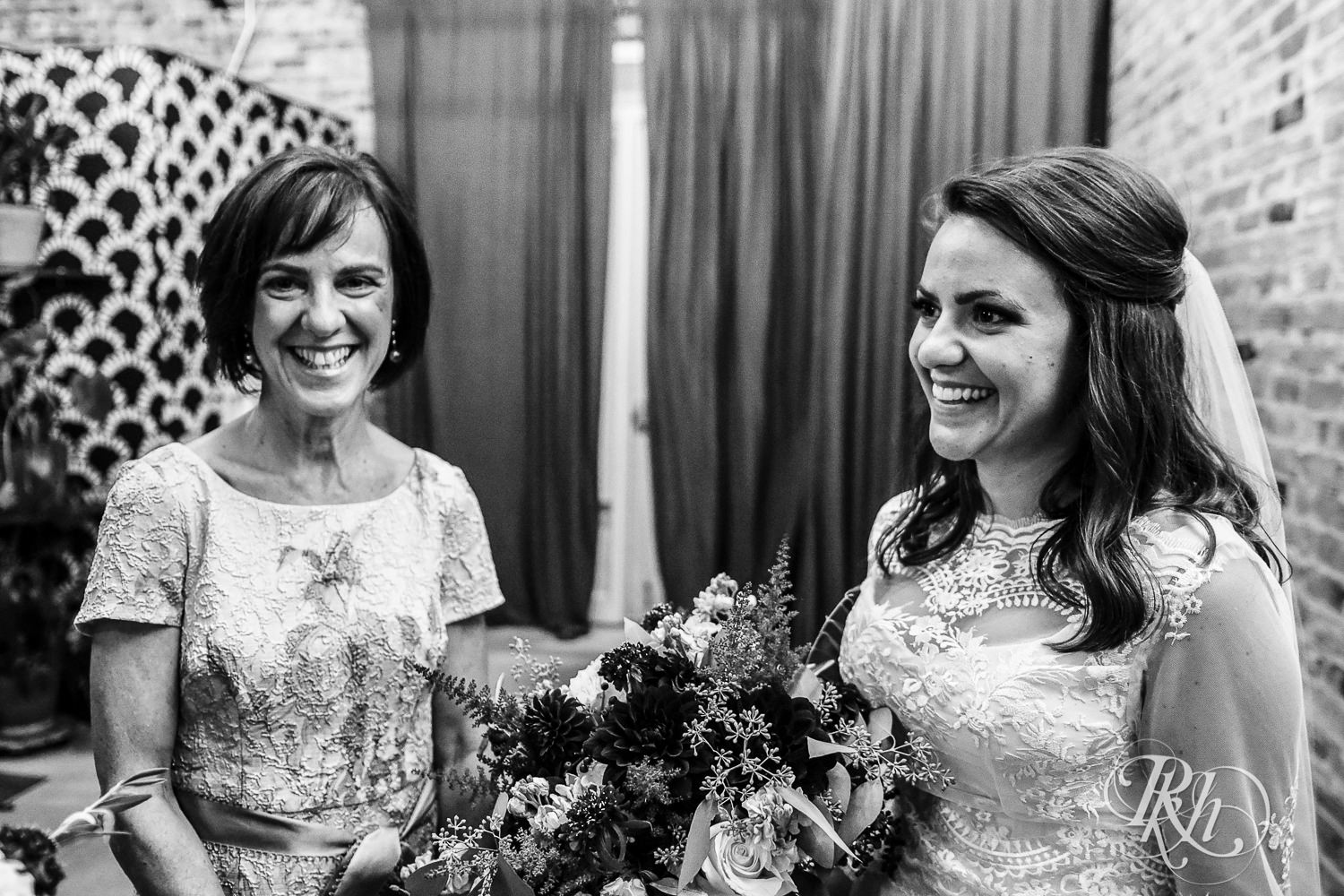 Bride and mom smile before wedding ceremony at Paikka in Saint Paul, Minnesota.