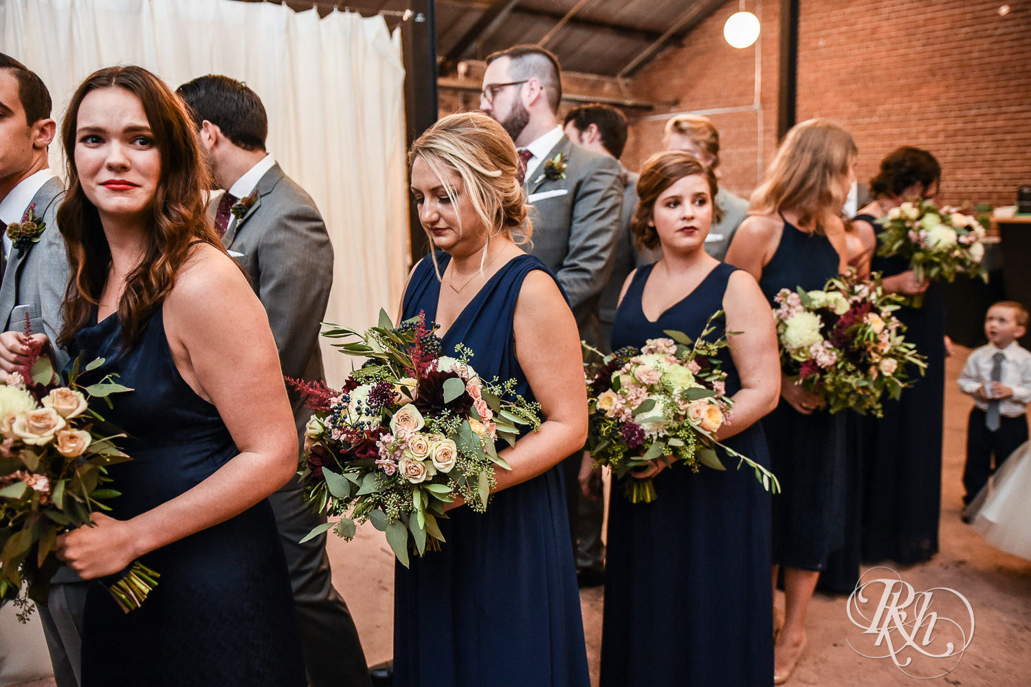 Wedding party lines up before wedding ceremony at Paikka in Saint Paul, Minnesota.