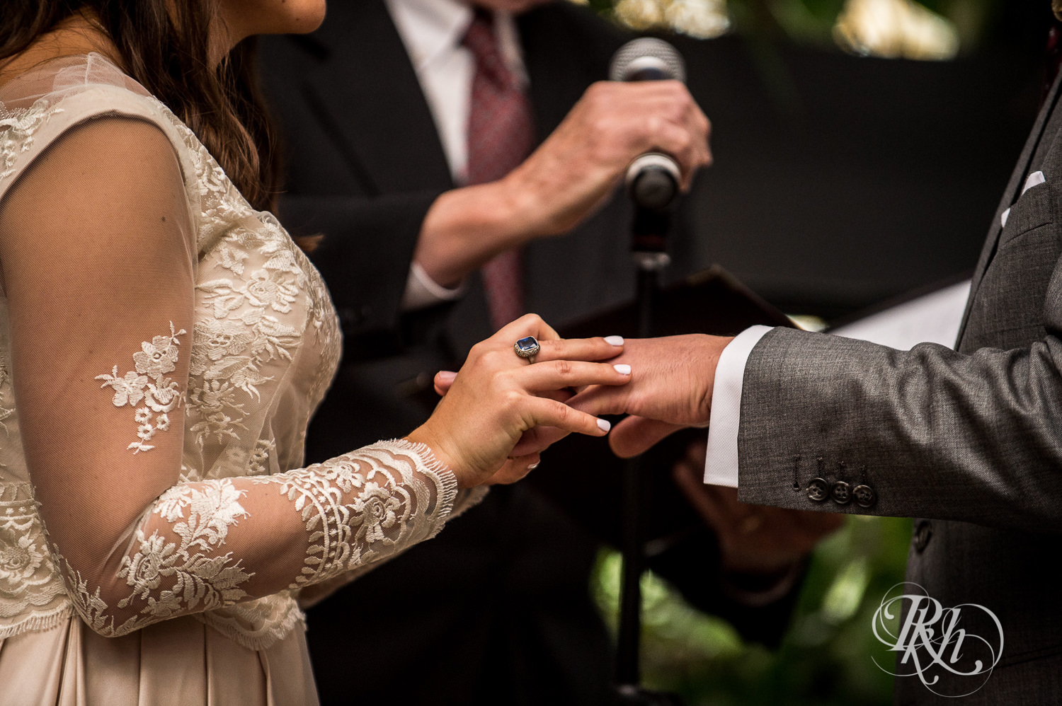 Bride and and groom exchange rings during wedding ceremony at Paikka in Saint Paul, Minnesota.