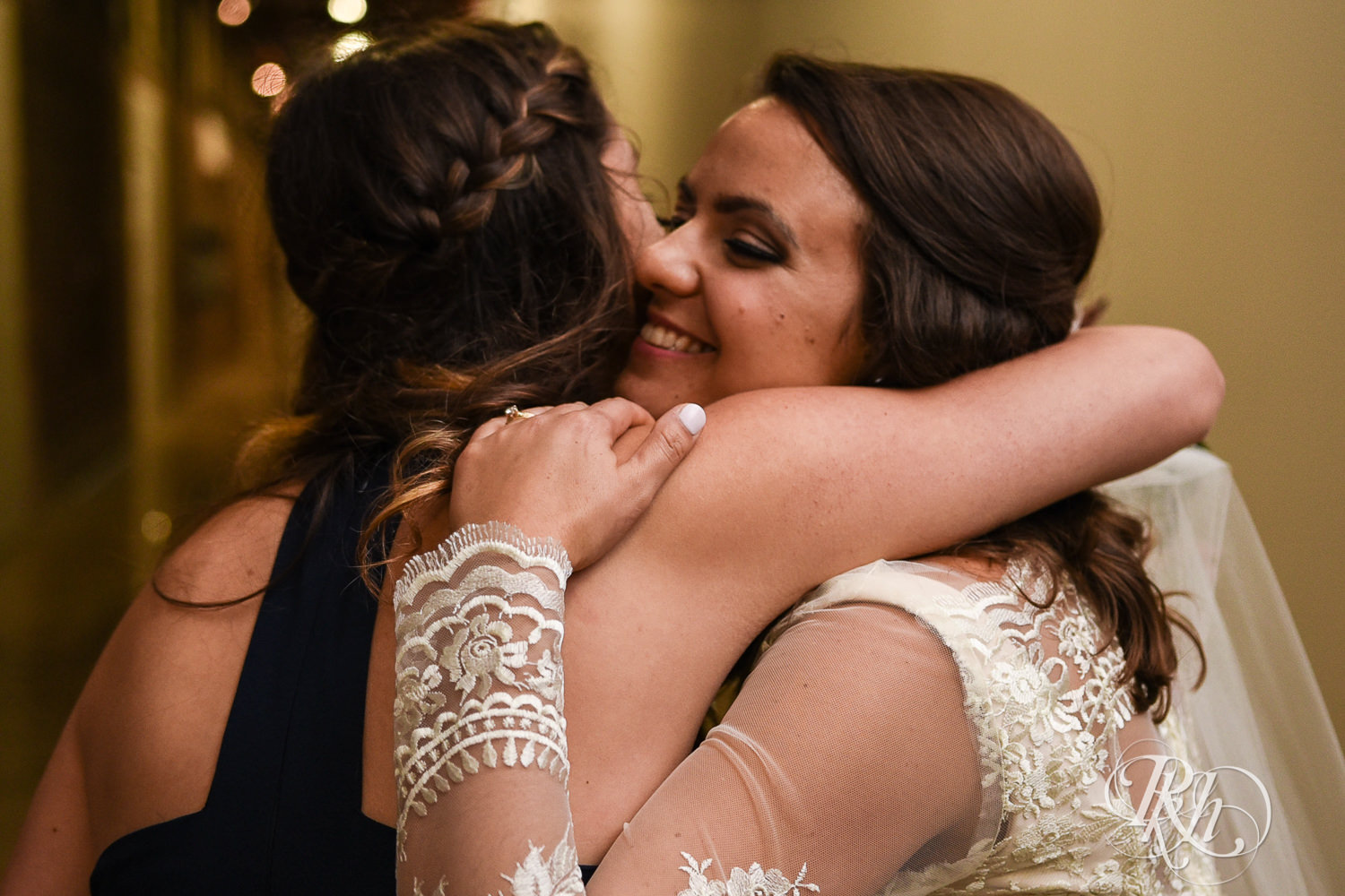 Bride and and groom hug guests after wedding ceremony at Paikka in Saint Paul, Minnesota.