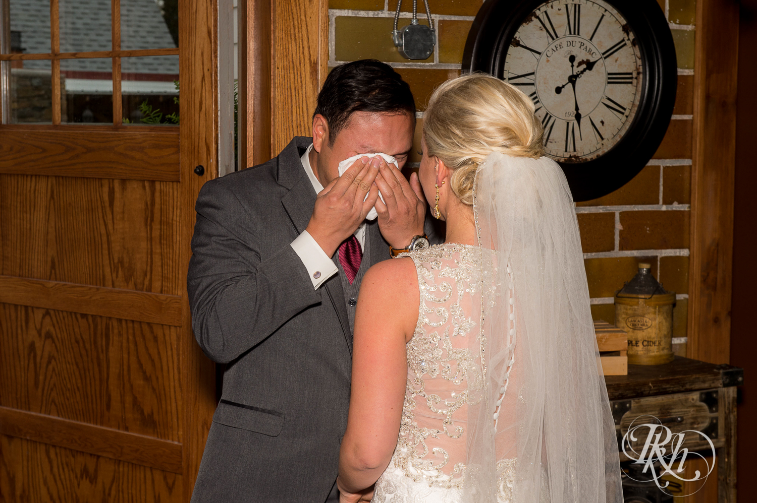 Groom breaks down crying at first look at barn wedding at Green Acres Event Center in Eden Prairie, Minnesota.