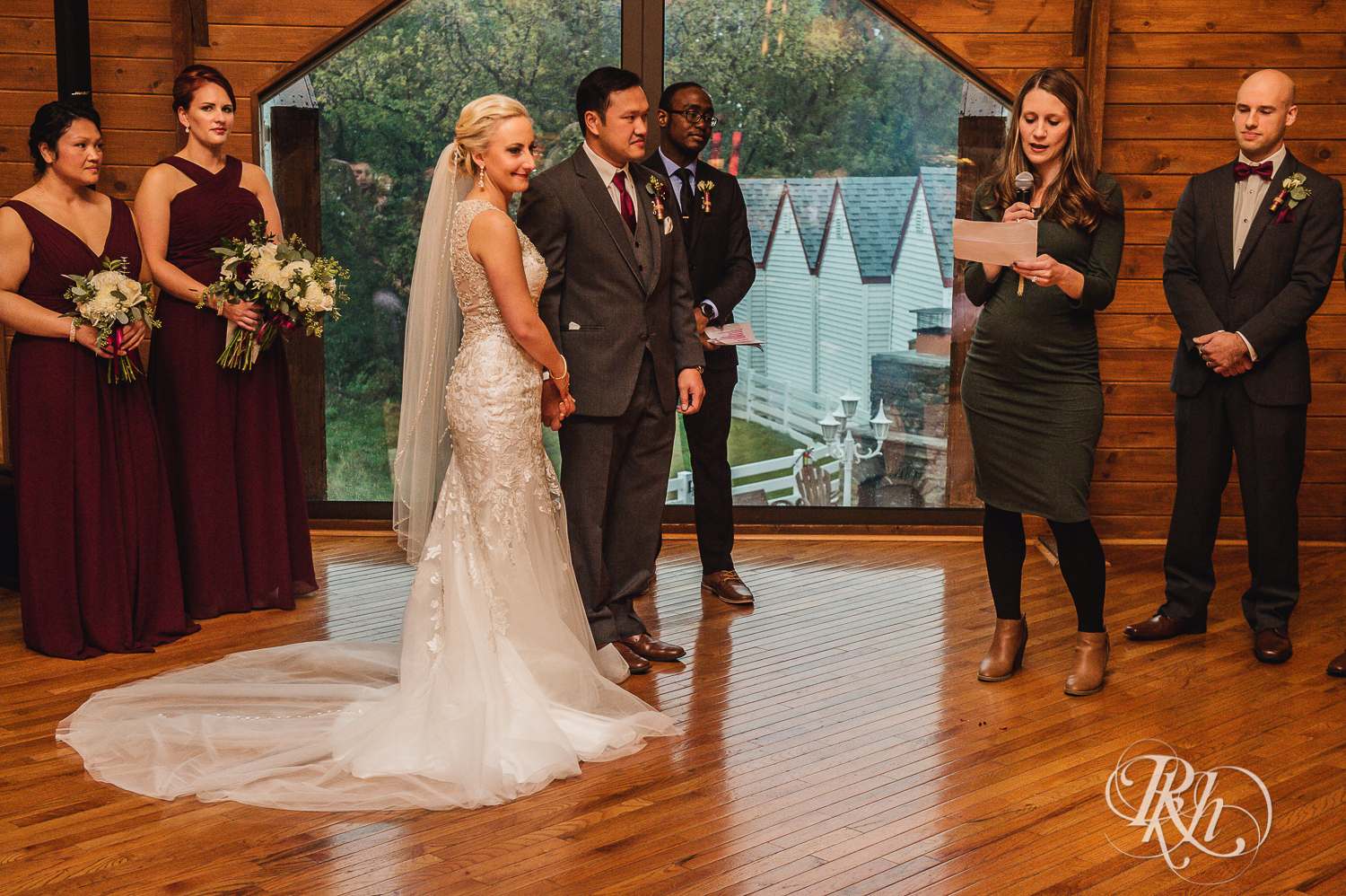 Bride and groom smile at Green Acres Event Center barn wedding ceremony in Eden Prairie, Minnesota.
