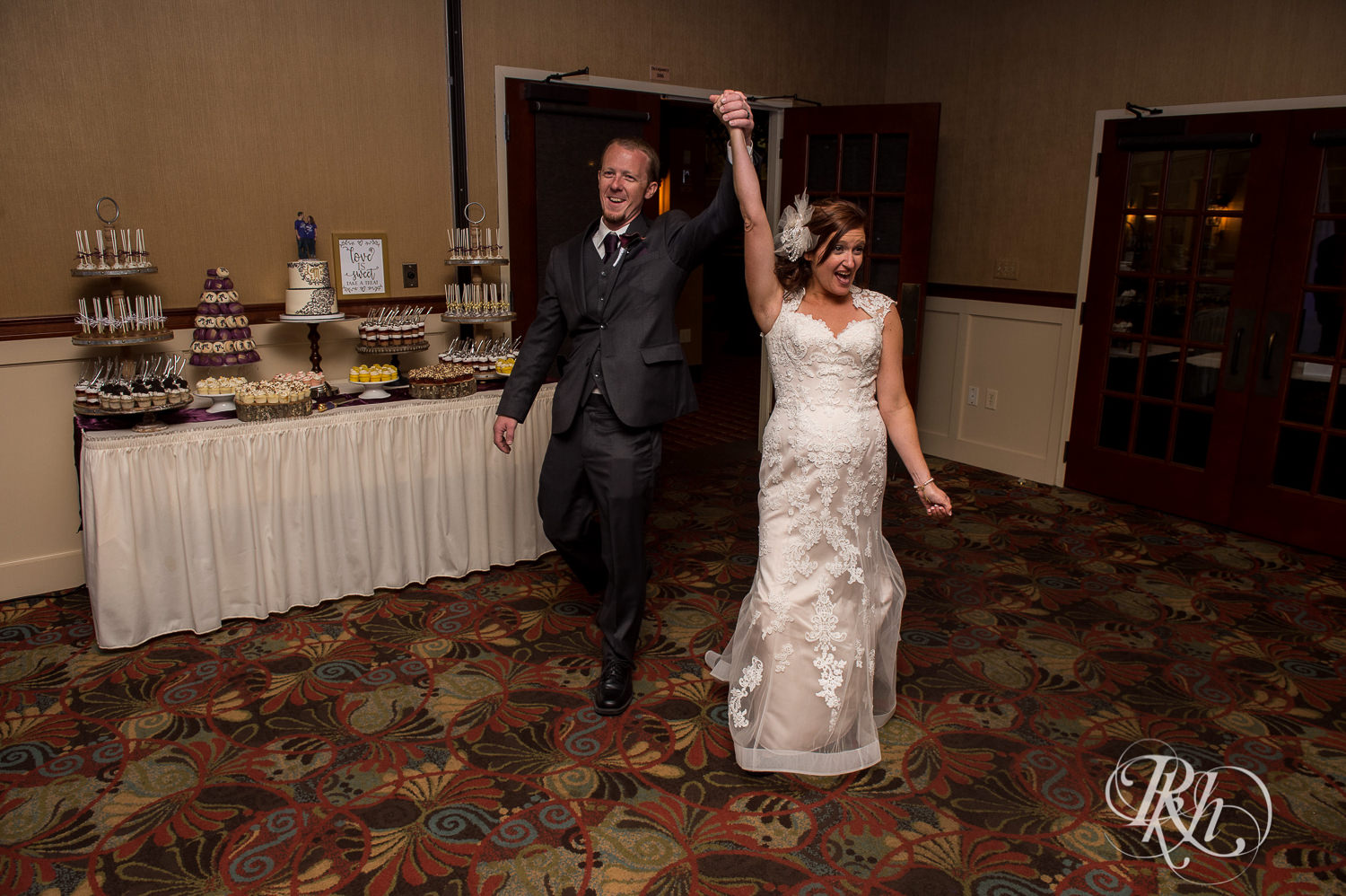 Bride and groom enter wedding reception at White Bear Country Inn in White Bear Lake, Minnesota.