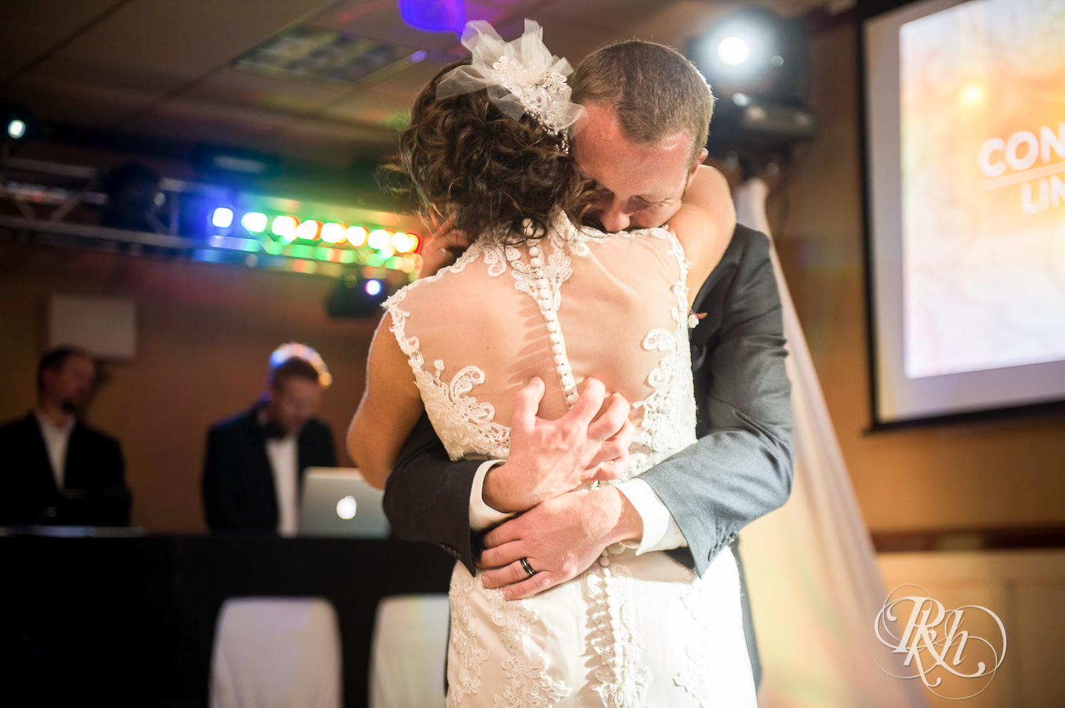 Bride and groom dance during wedding reception at White Bear Country Inn in White Bear Lake, Minnesota.