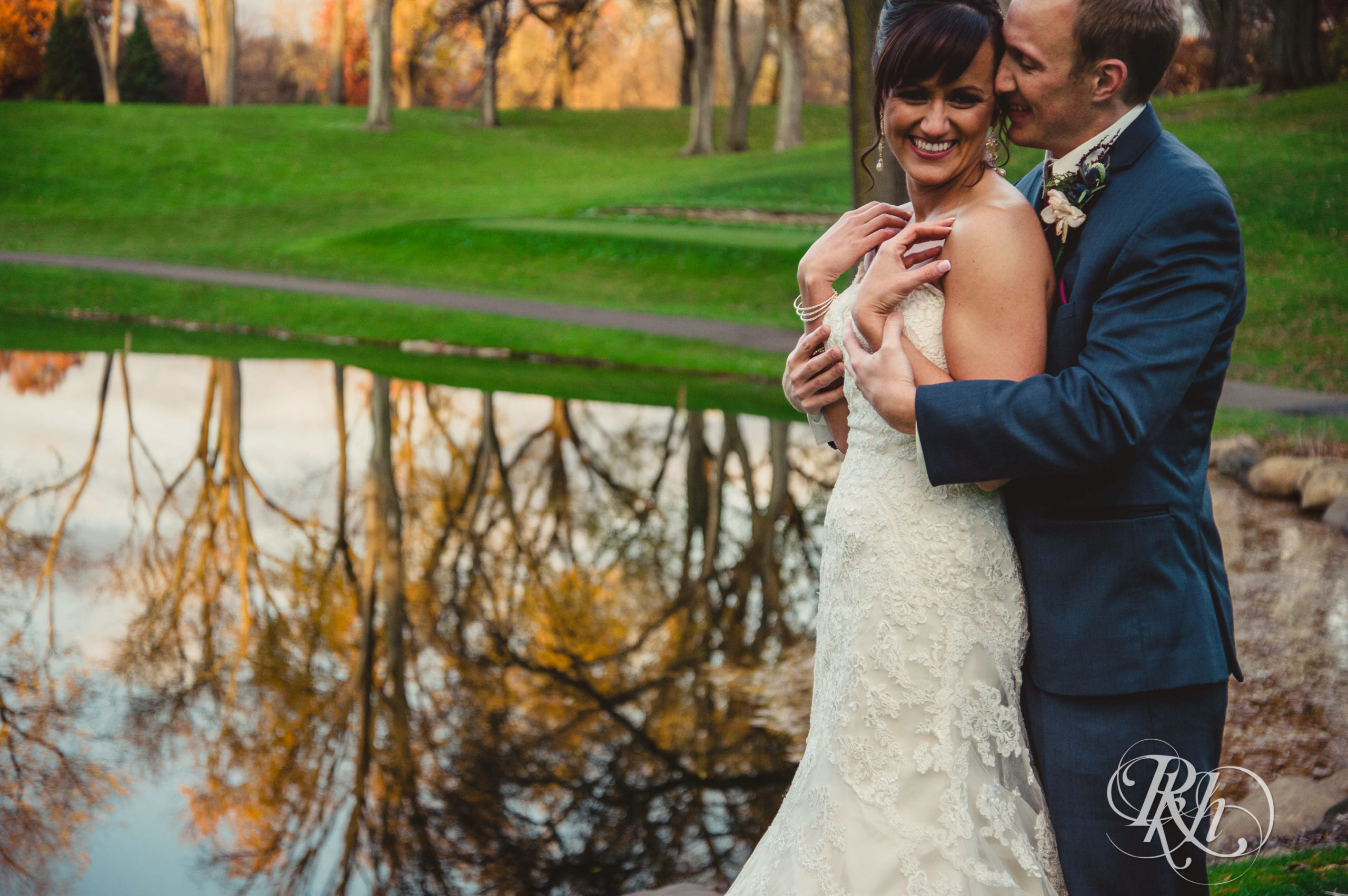 Bride and groom smile on fall wedding day at Minneapolis Golf Club in Minneapolis, Minnesota.