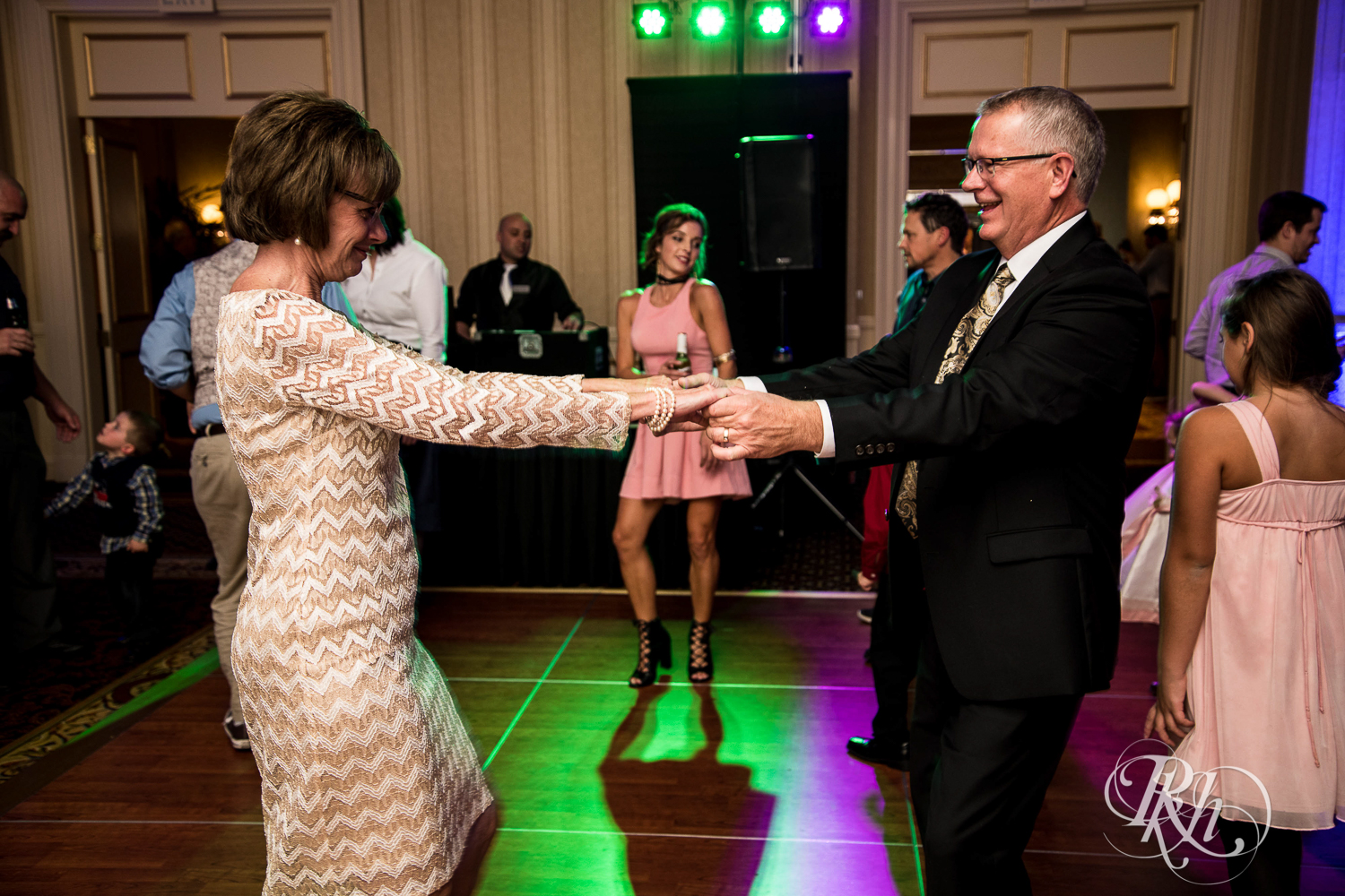 Guests dance at wedding reception at The Saint Paul Hotel in Saint Paul, Minnesota.