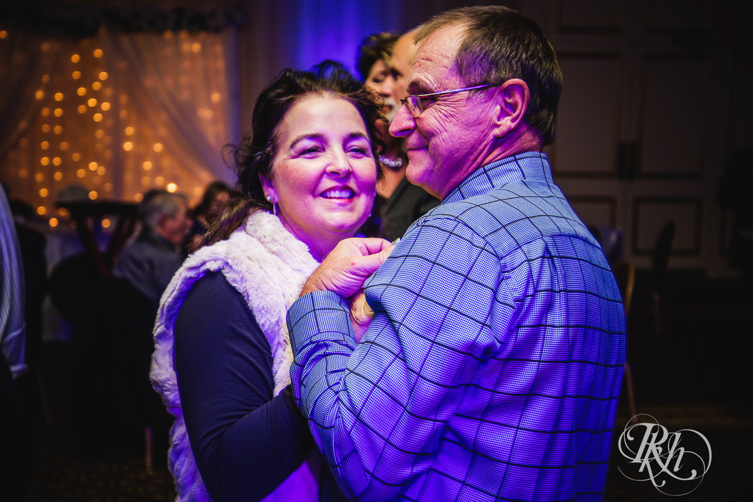 Guests dance at wedding reception at The Saint Paul Hotel in Saint Paul, Minnesota.