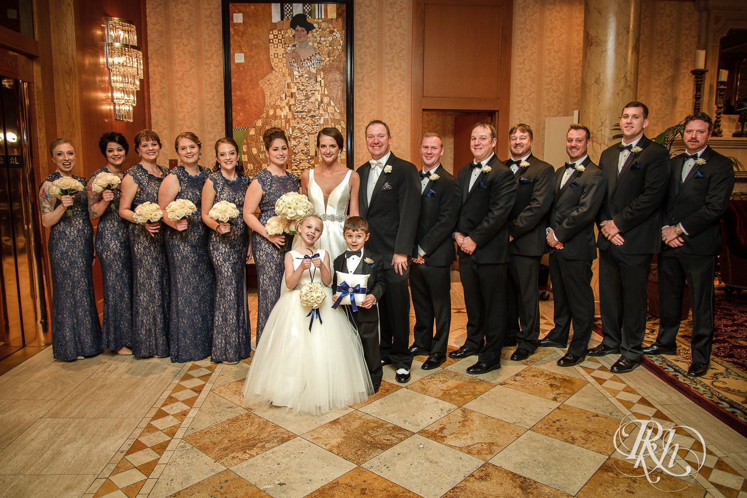 Wedding party smiles at The Saint Paul Hotel in Saint Paul, Minnesota.