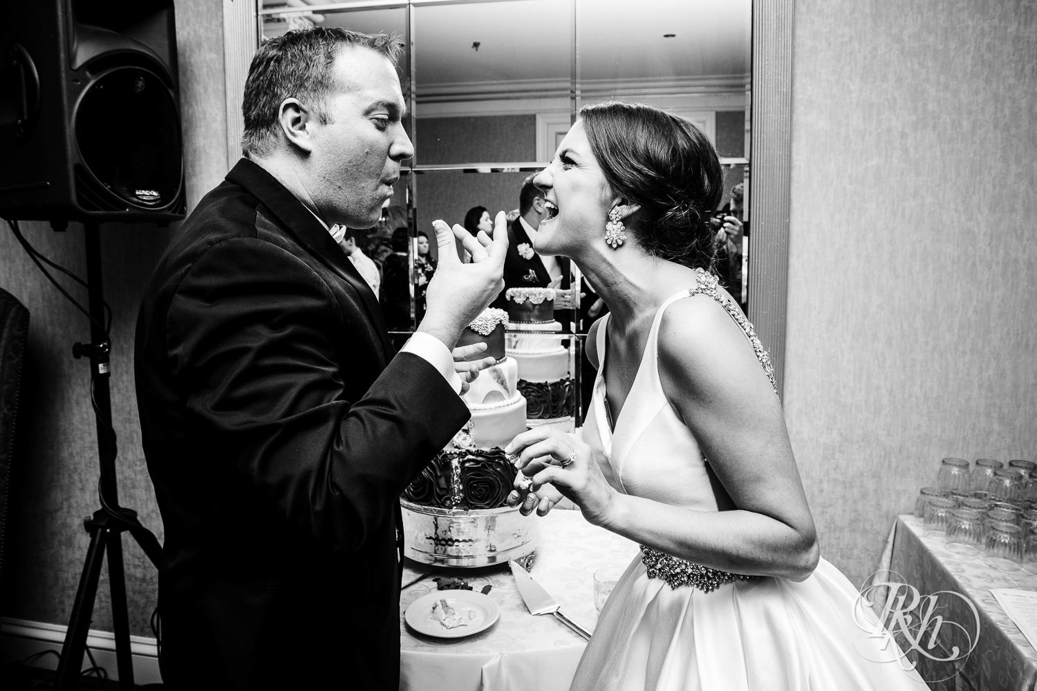 Bride and groom cut wedding cake at The Saint Paul Hotel in Saint Paul, Minnesota.