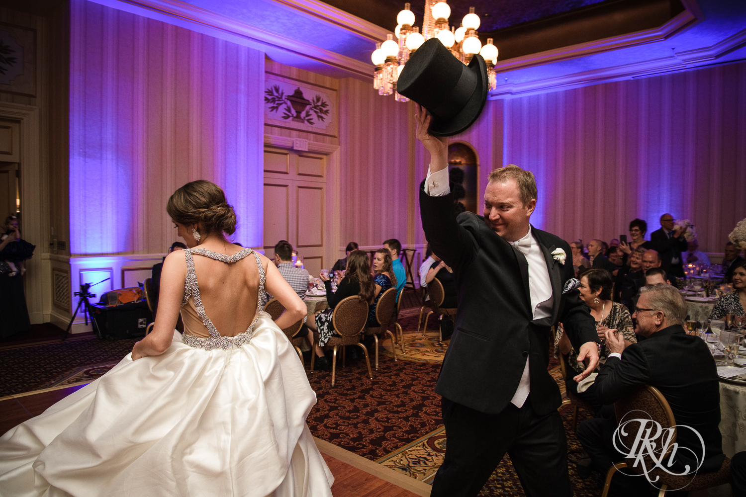 Bride and groom enter wedding reception at The Saint Paul Hotel in Saint Paul, Minnesota.