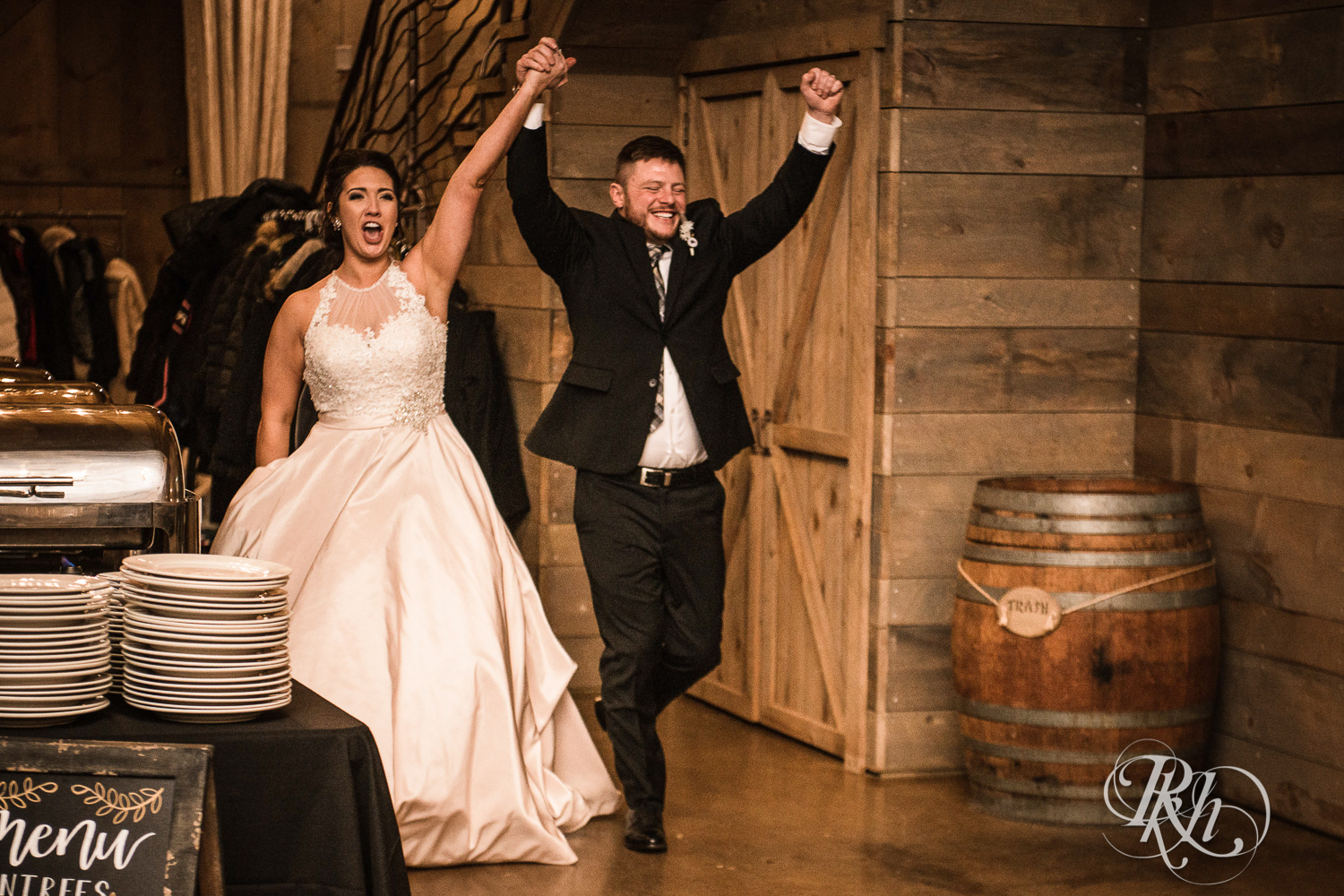 Bride and groom enter new year's eve wedding reception at Creekside Farm in Rush City, Minnesota.