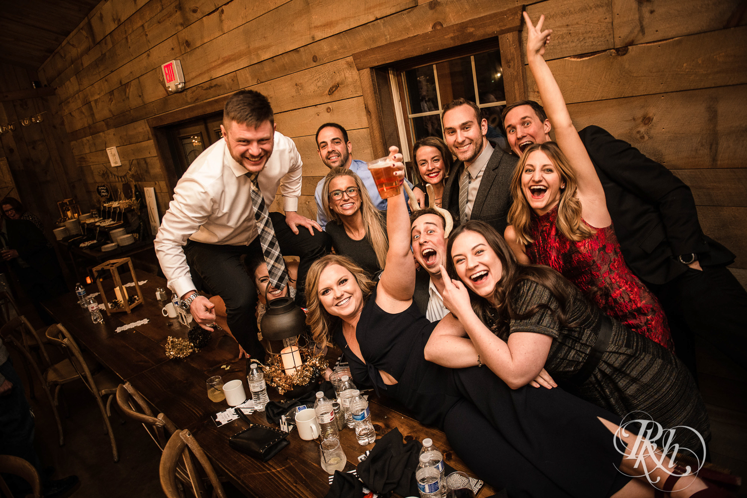 Bride and groom smile with guests during reception at Creekside Farm in Rush City, Minnesota.