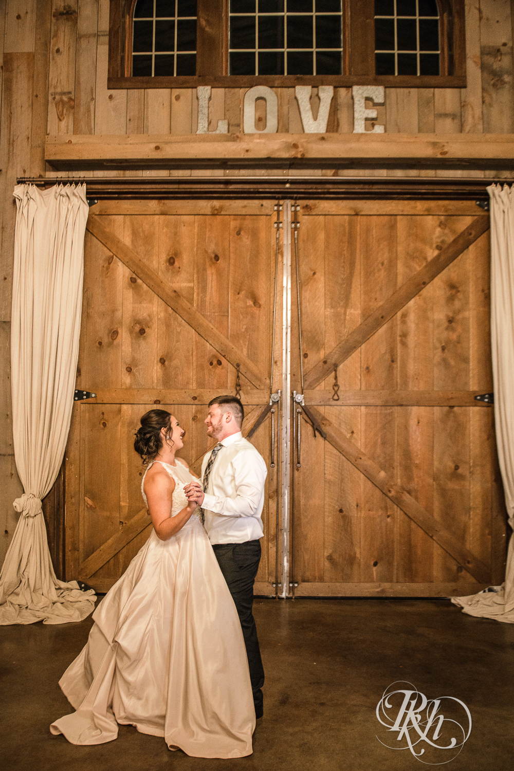 Bride and groom share first dance during reception at Creekside Farm in Rush City, Minnesota.
