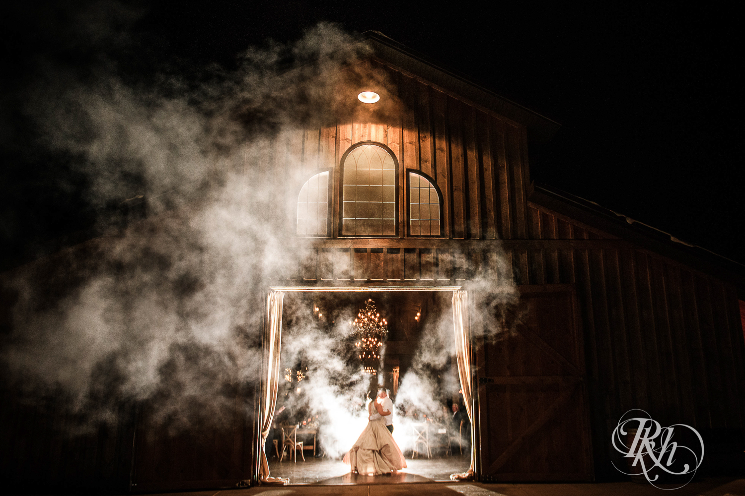 Bride and groom share first dance during reception at Creekside Farm in Rush City, Minnesota.