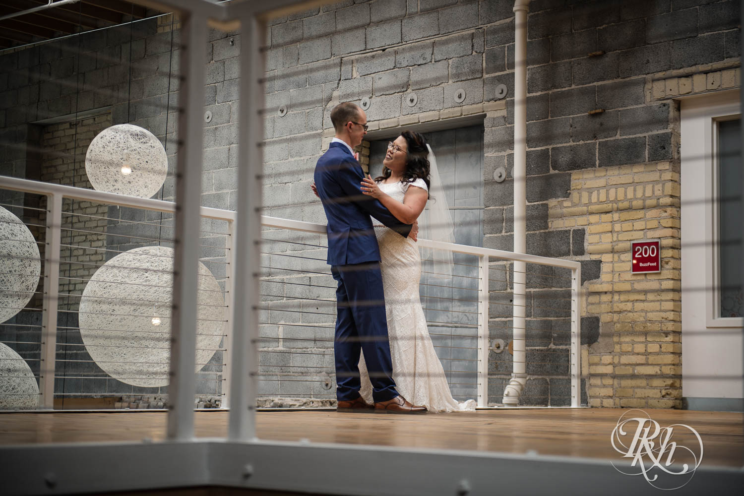 Asian bride and groom see each other during first look at 612 Brew in Minneapolis, Minnesota.