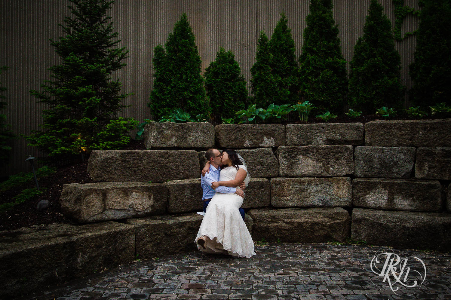 Asian bride and groom kiss at 612 Brew in Minneapolis, Minnesota.