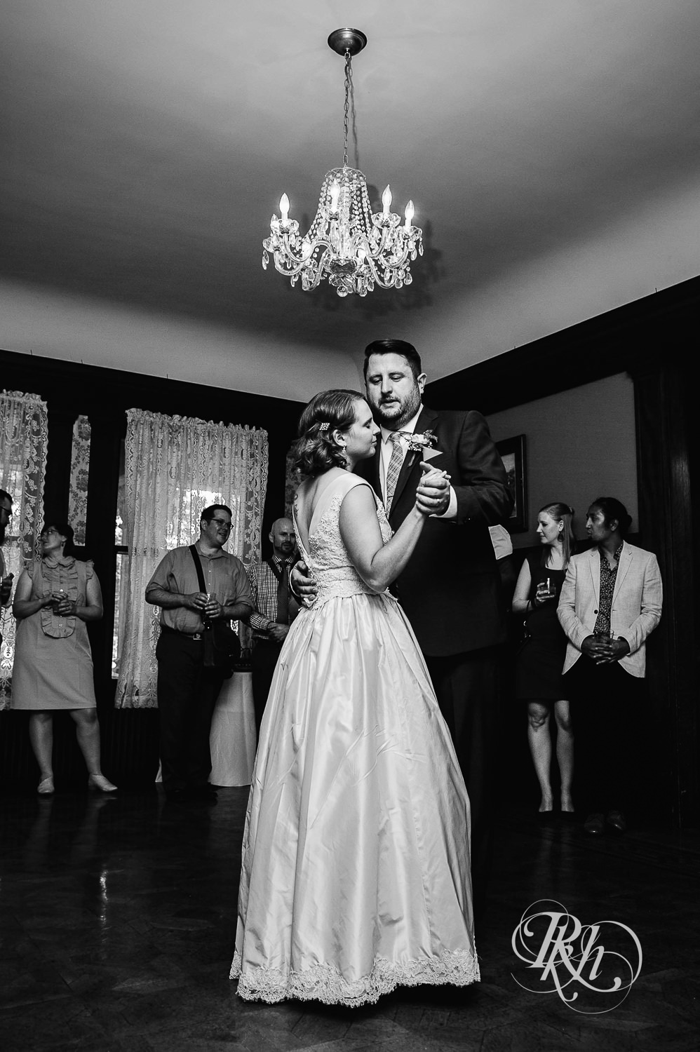 Bride and groom dance during wedding reception at Summit Manor wedding in Saint Paul, Minnesota.
