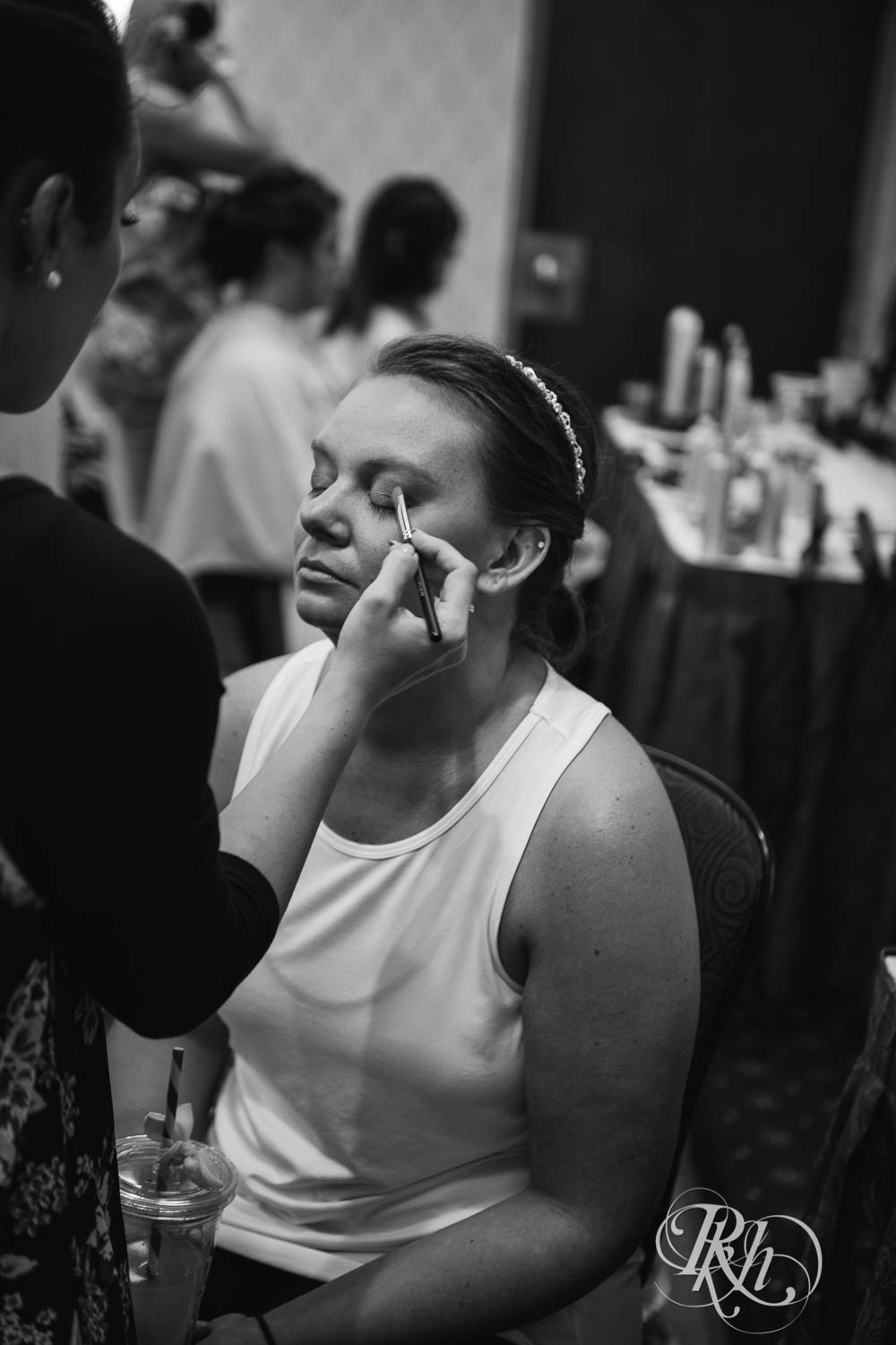 Bride getting makeup done at Crowne Plaza Minneapolis Northstar Downtown in Minneapolis, Minnesota.