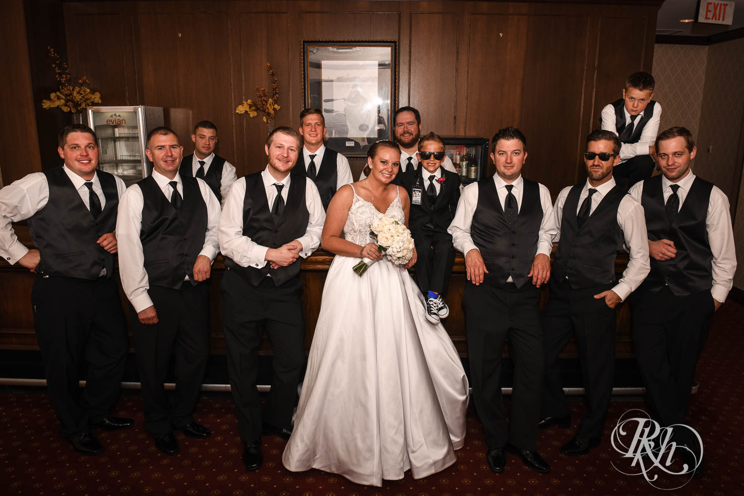 Wedding party smiles with bride at Crowne Plaza Minneapolis Northstar Downtown in Minneapolis, Minnesota.