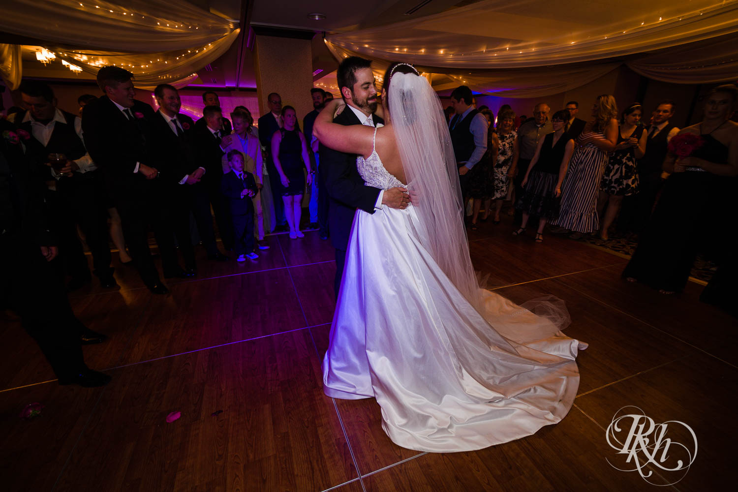 Bride and groom dance with guests at Crowne Plaza Minneapolis Northstar Downtown in Minneapolis, Minnesota.
