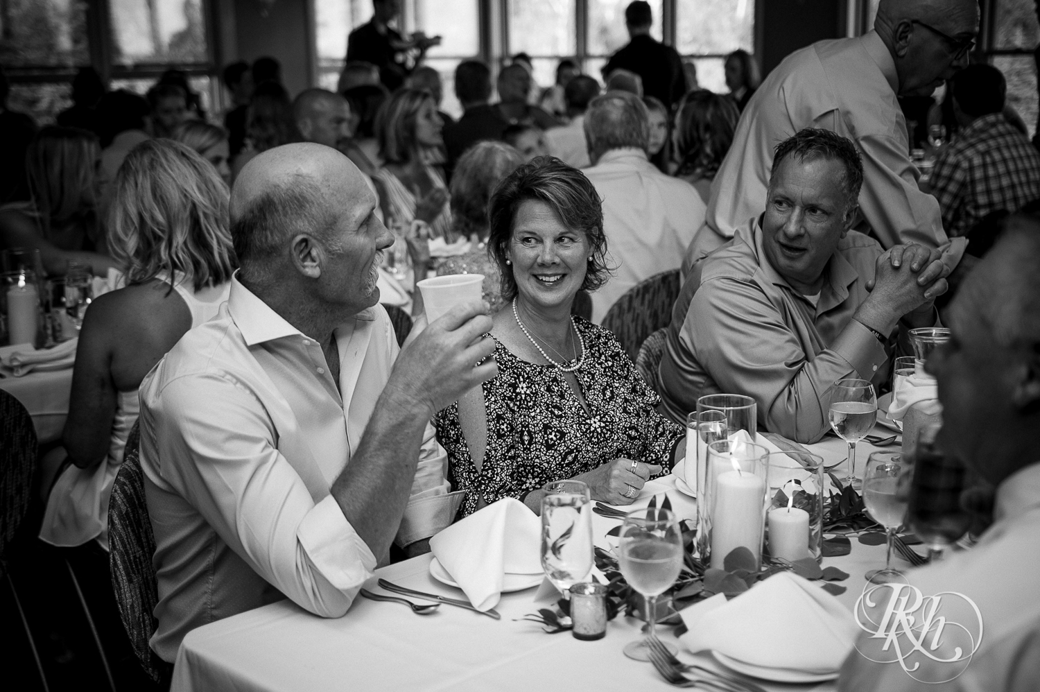 Guests mingle during cocktail hour at Bluefin Bay wedding in Tofte, Minnesota.
