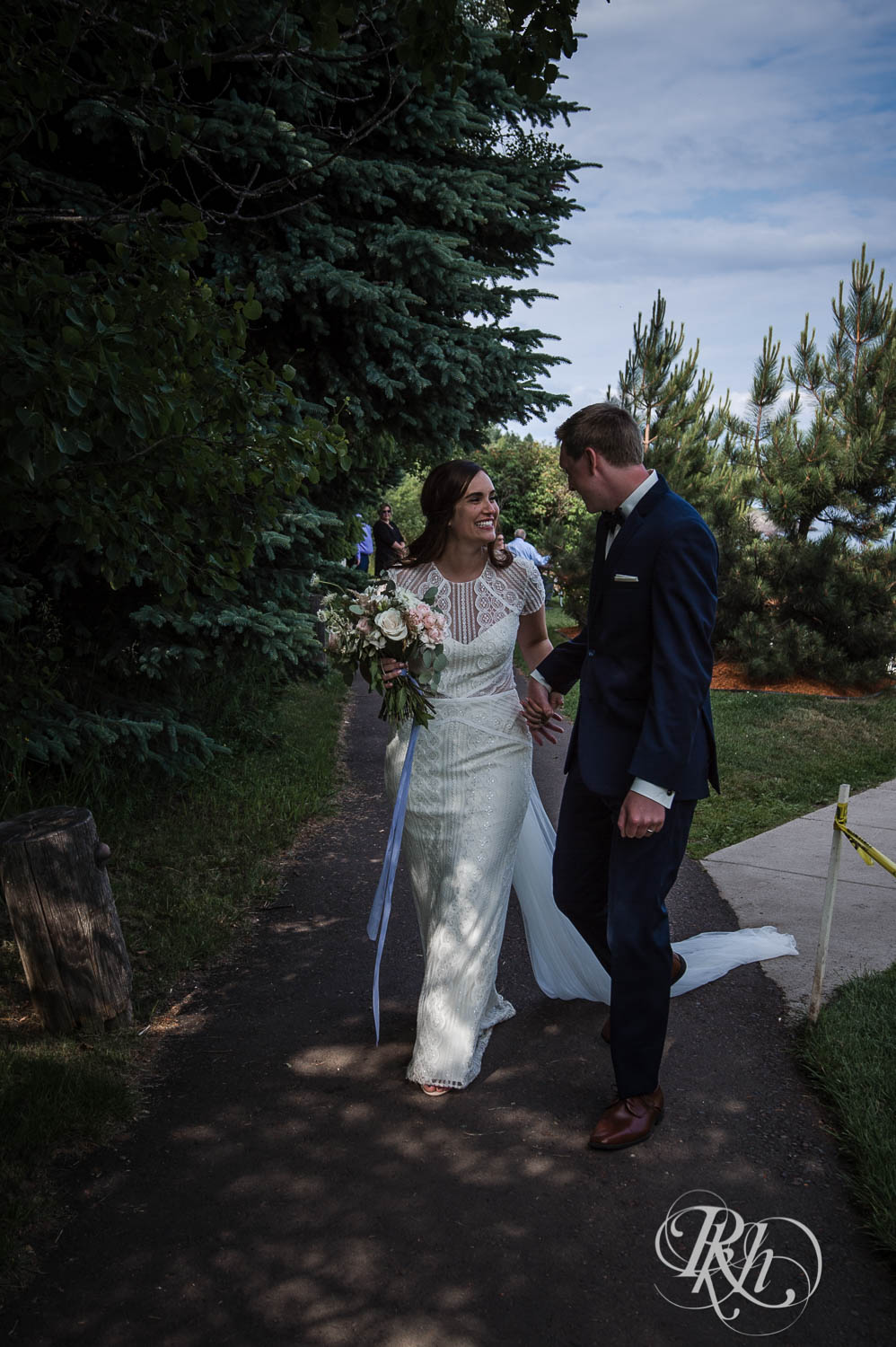 Bride and groom smile after ceremony at their Bluefin Bay wedding in Tofte, Minnesota.