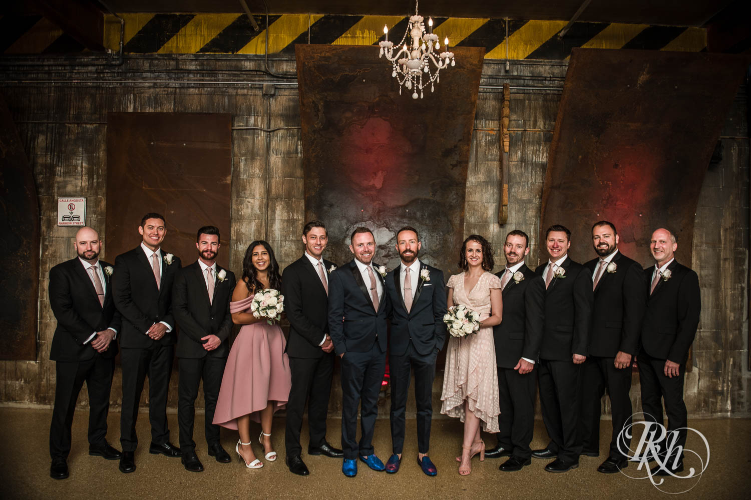 Grooms smile with wedding party at Warehouse Winery wedding in Saint Louis Park, Minnesota.