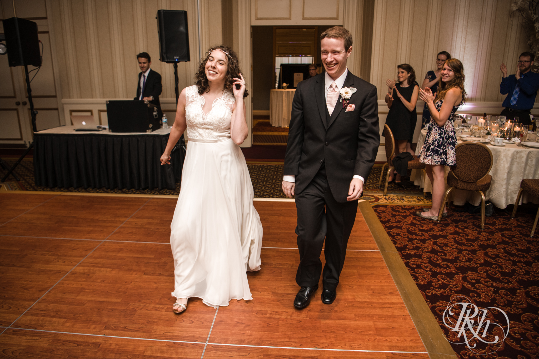 Bride and groom enter wedding reception at the Saint Paul Hotel in Saint Paul, Minnesota.