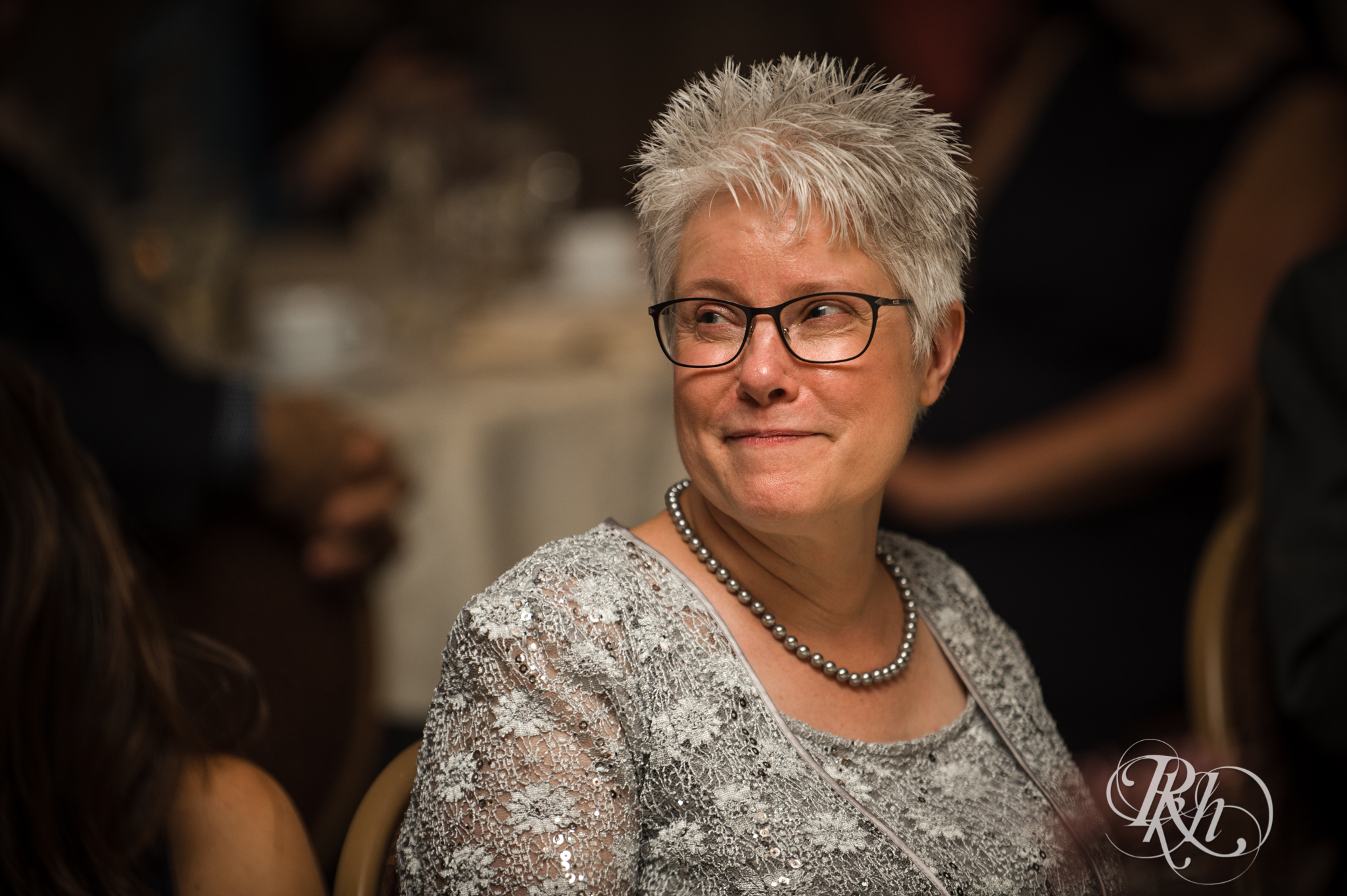Mother of groom smiles during wedding reception at the Saint Paul Hotel in Saint Paul, Minnesota.