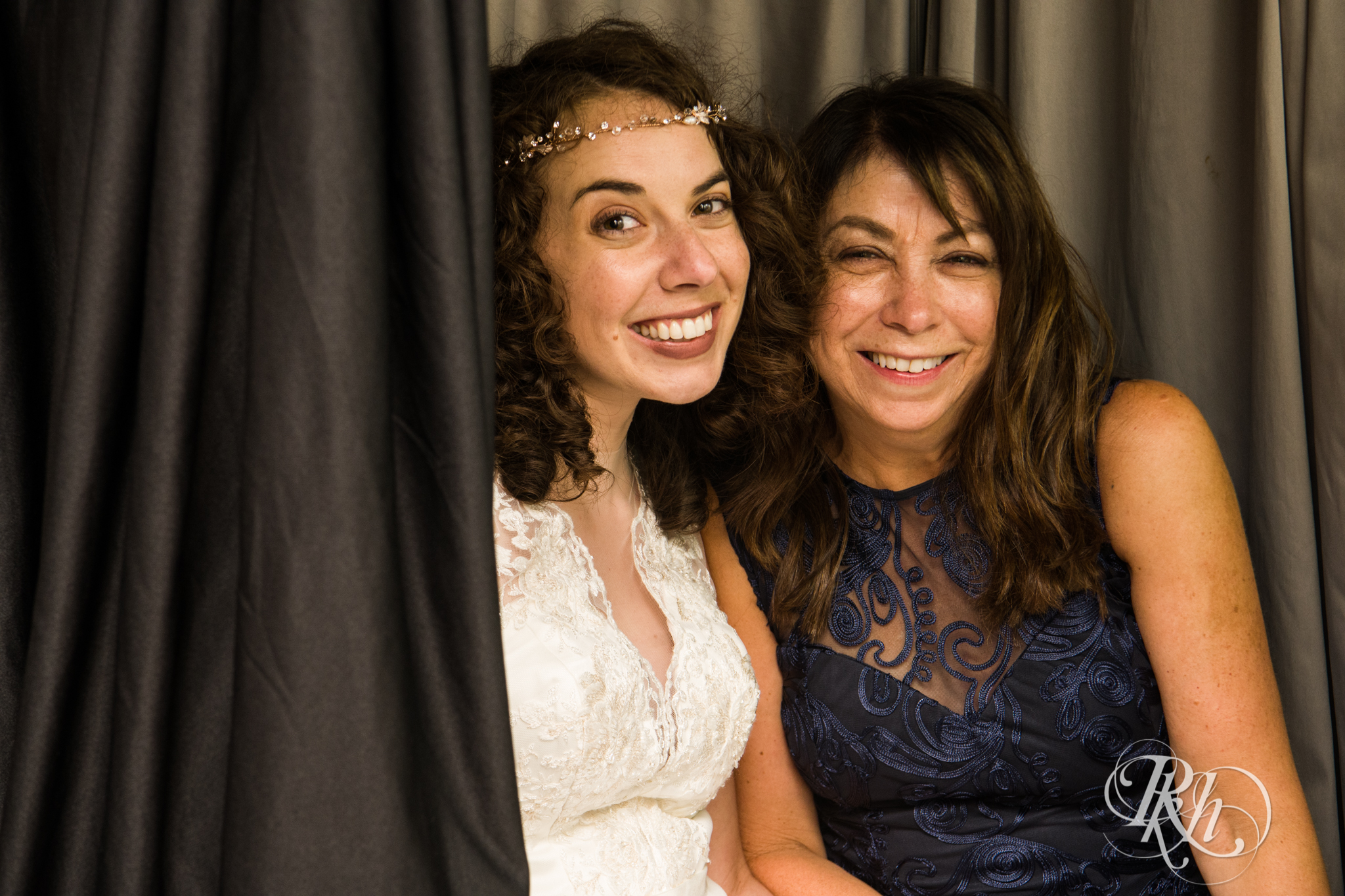Bride smiles with mom during wedding reception at the Saint Paul Hotel in Saint Paul, Minnesota.