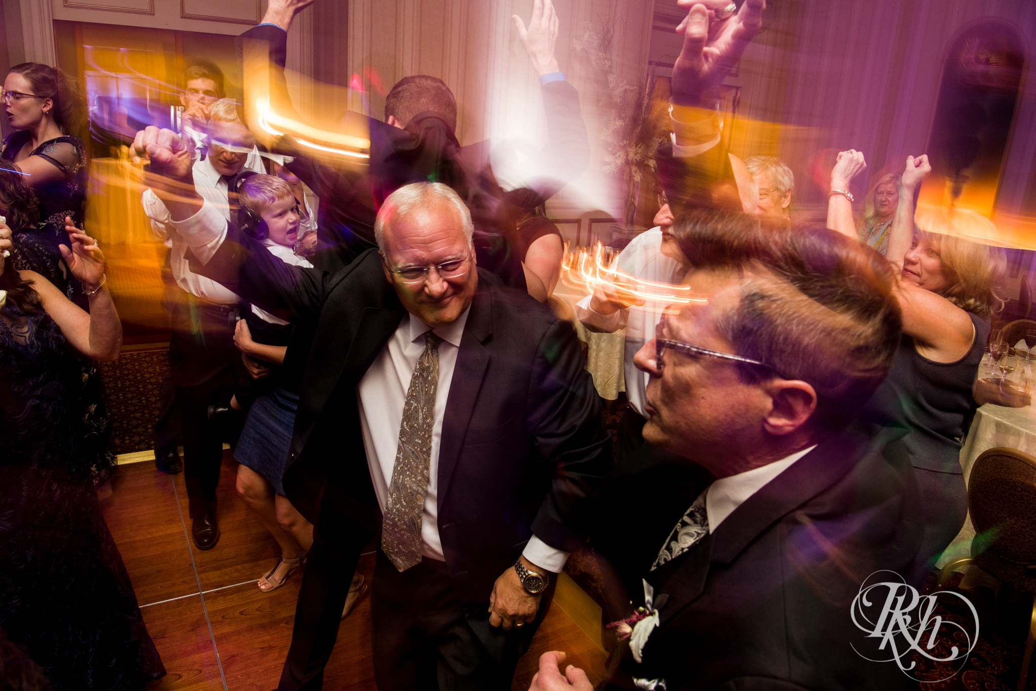 Guests dance during wedding reception at the Saint Paul Hotel in Saint Paul, Minnesota.