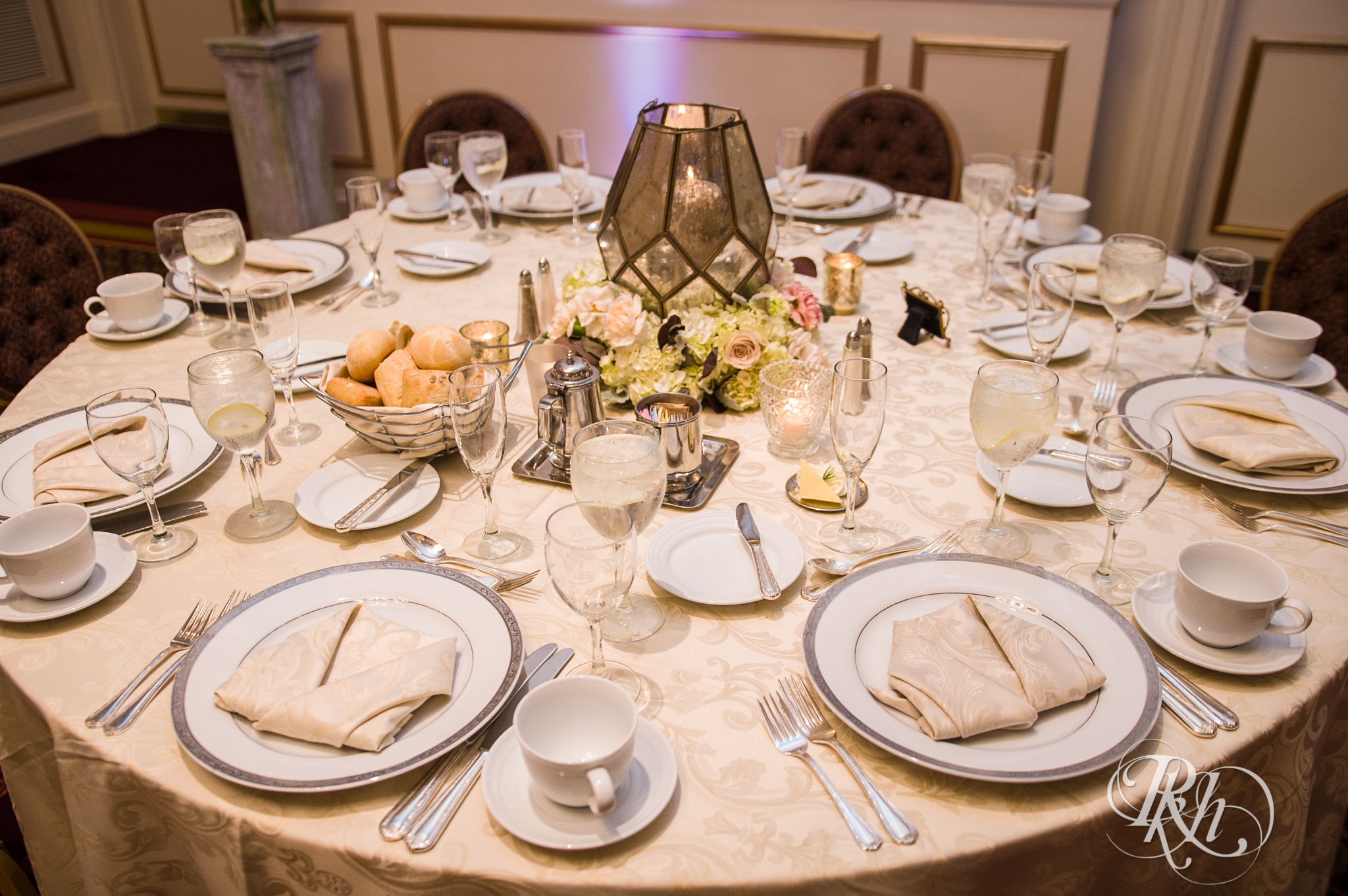 Indoor wedding reception table setup at the Saint Paul Hotel in Saint Paul, Minnesota.