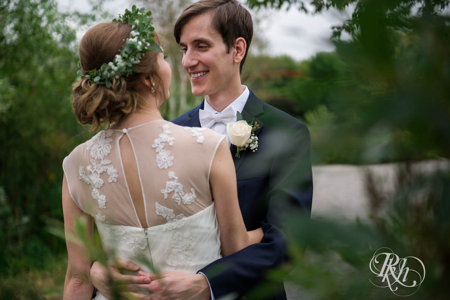 Bride and groom smile at Plymouth Creek Center wedding in Plymouth, Minnesota.