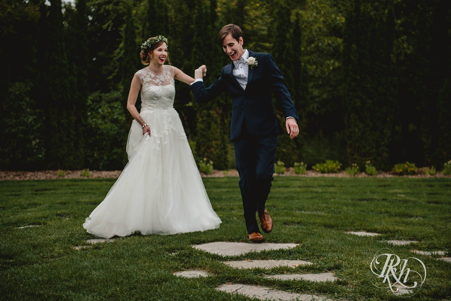 Bride and groom smile at Plymouth Creek Center wedding in Plymouth, Minnesota.