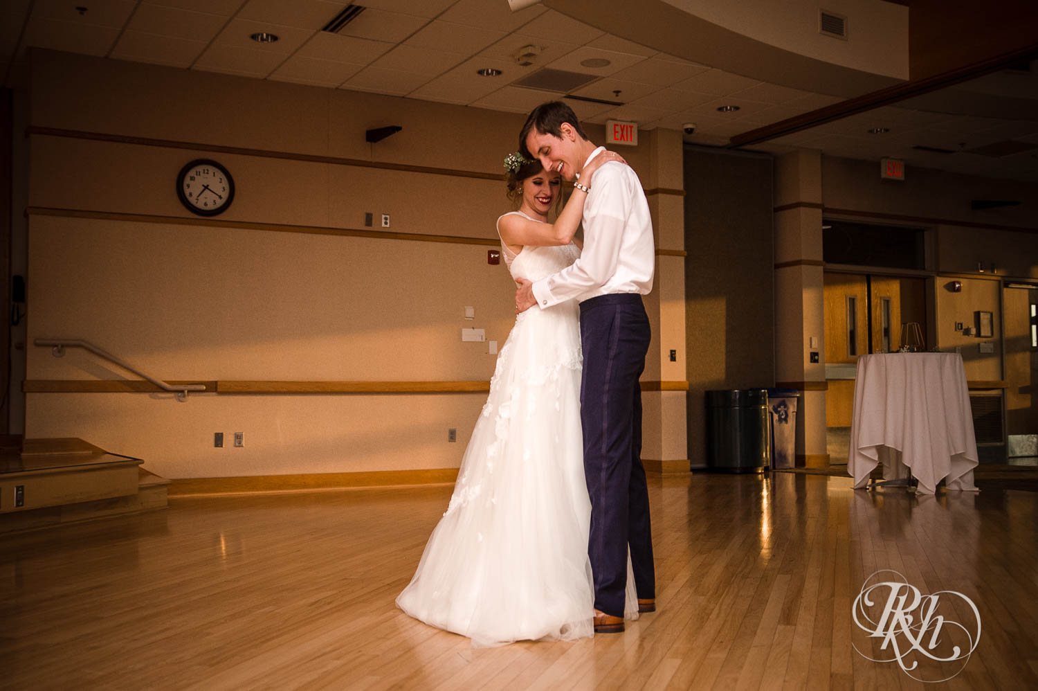 Bride and groom dance during wedding reception at Plymouth Creek Center in Plymouth, Minnesota.