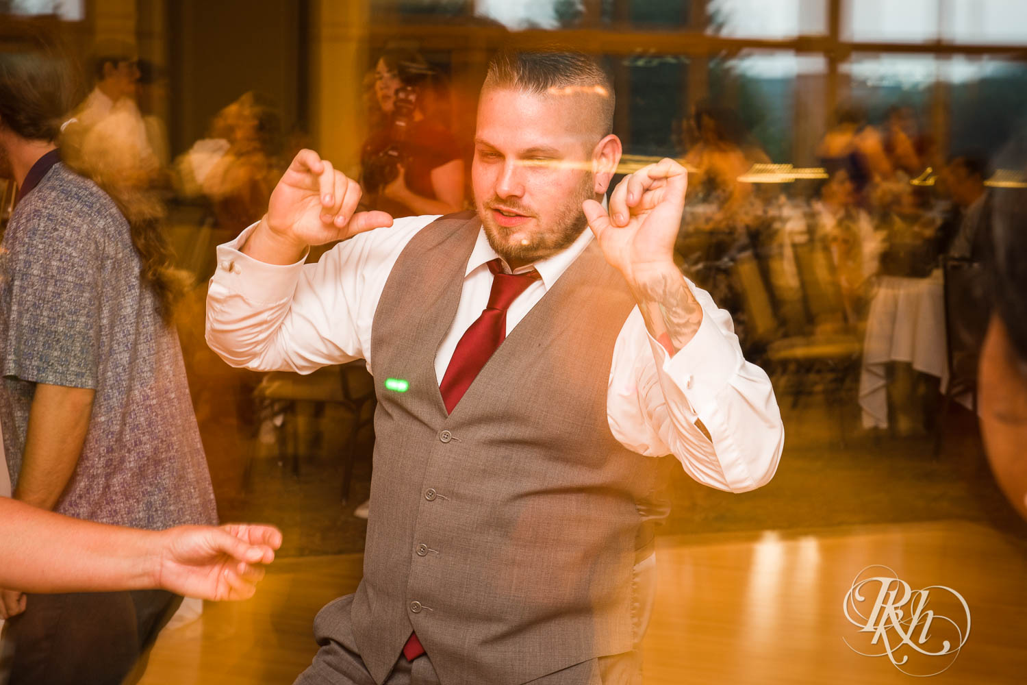 Guests dance during wedding reception at Plymouth Creek Center in Plymouth, Minnesota.