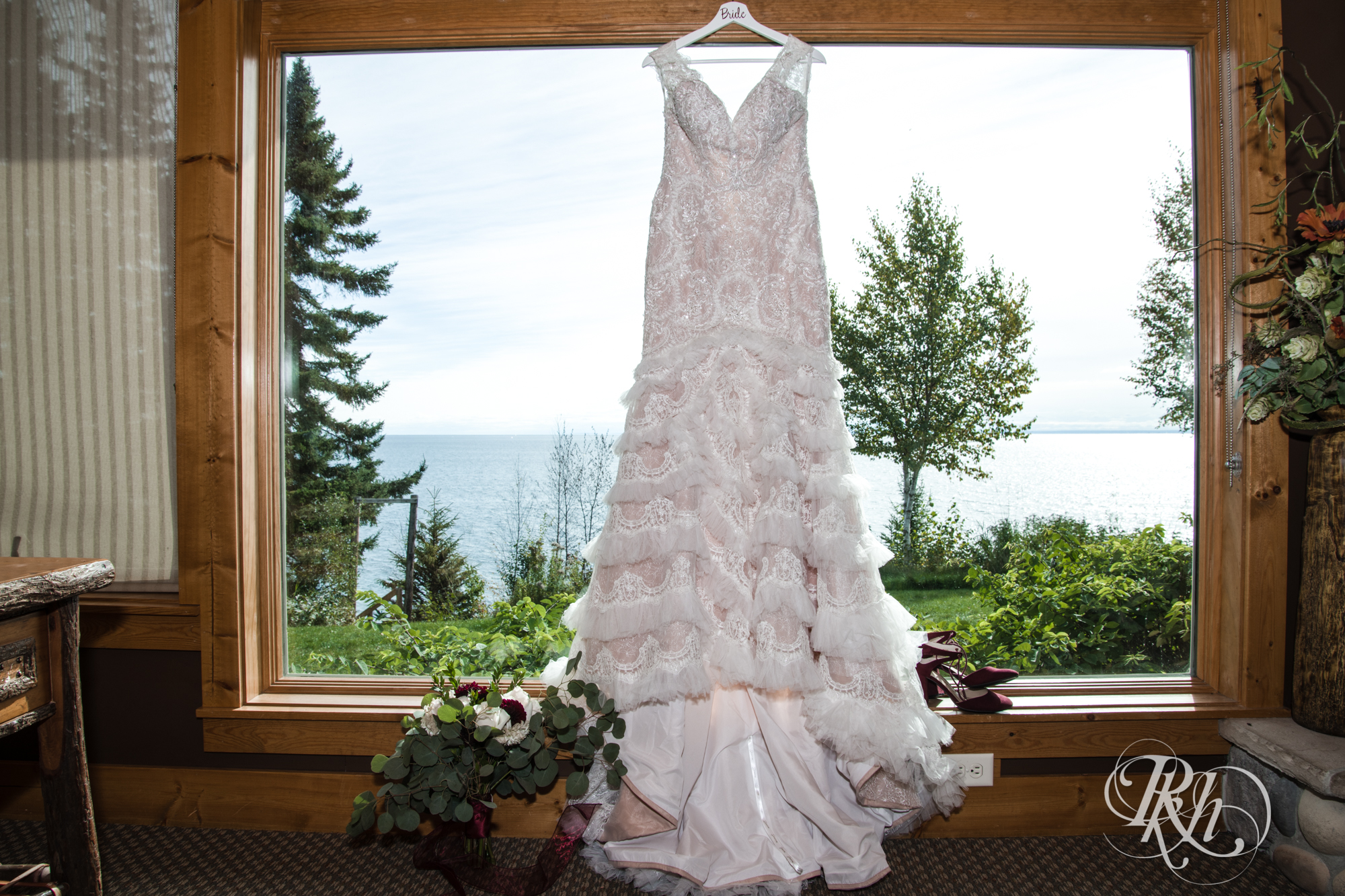 Wedding dress hanging in window at Grand Superior Lodge in Two Harbors, Minnesota.