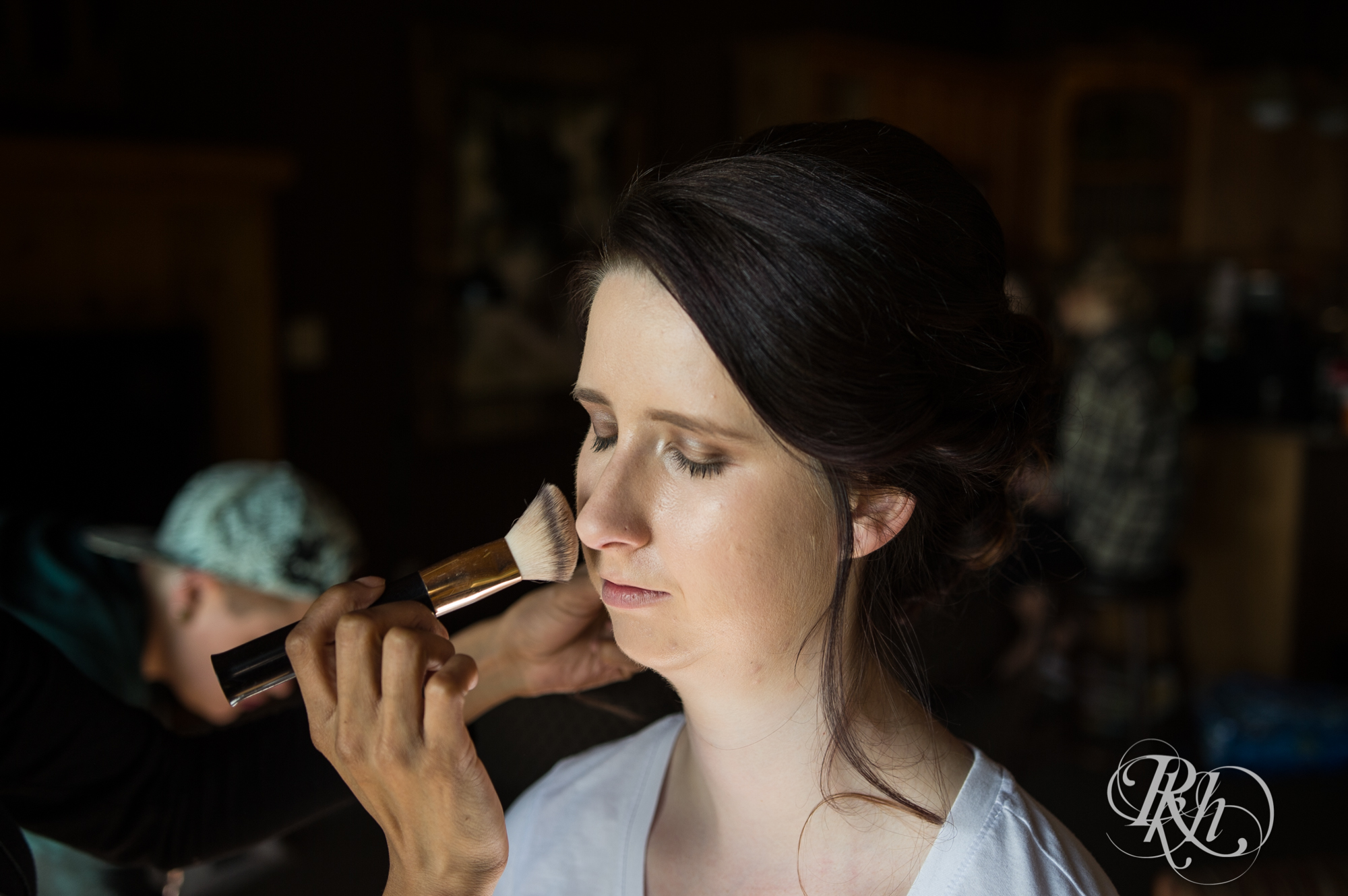 Bride getting wedding makeup applied at Grand Superior Lodge in Two Harbors, Minnesota.